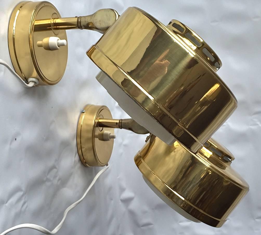 A pair of Swedish wall-mounted reading lamps, circa 1970s.
Polished brass with adjustable lighting heads. Marked by manufacturer.
Measures: depth-10.5