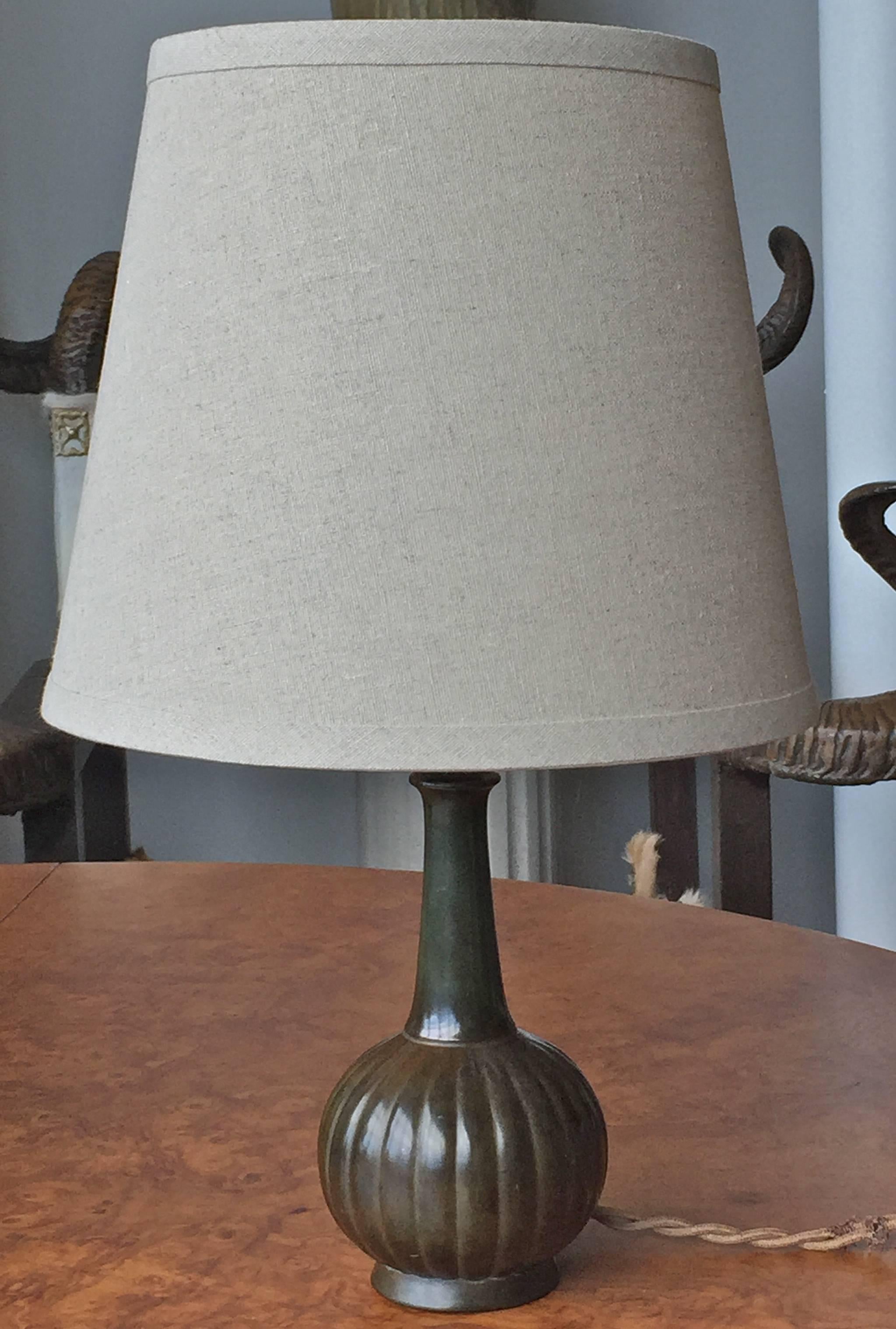 A table lamp designed by Just Andersen, Denmark, circa 1930s.
Patinated disco metal. Marked: Just Denmark D140.
Need to be electrify. Rewiring available upon request.
Dimensions: H 16