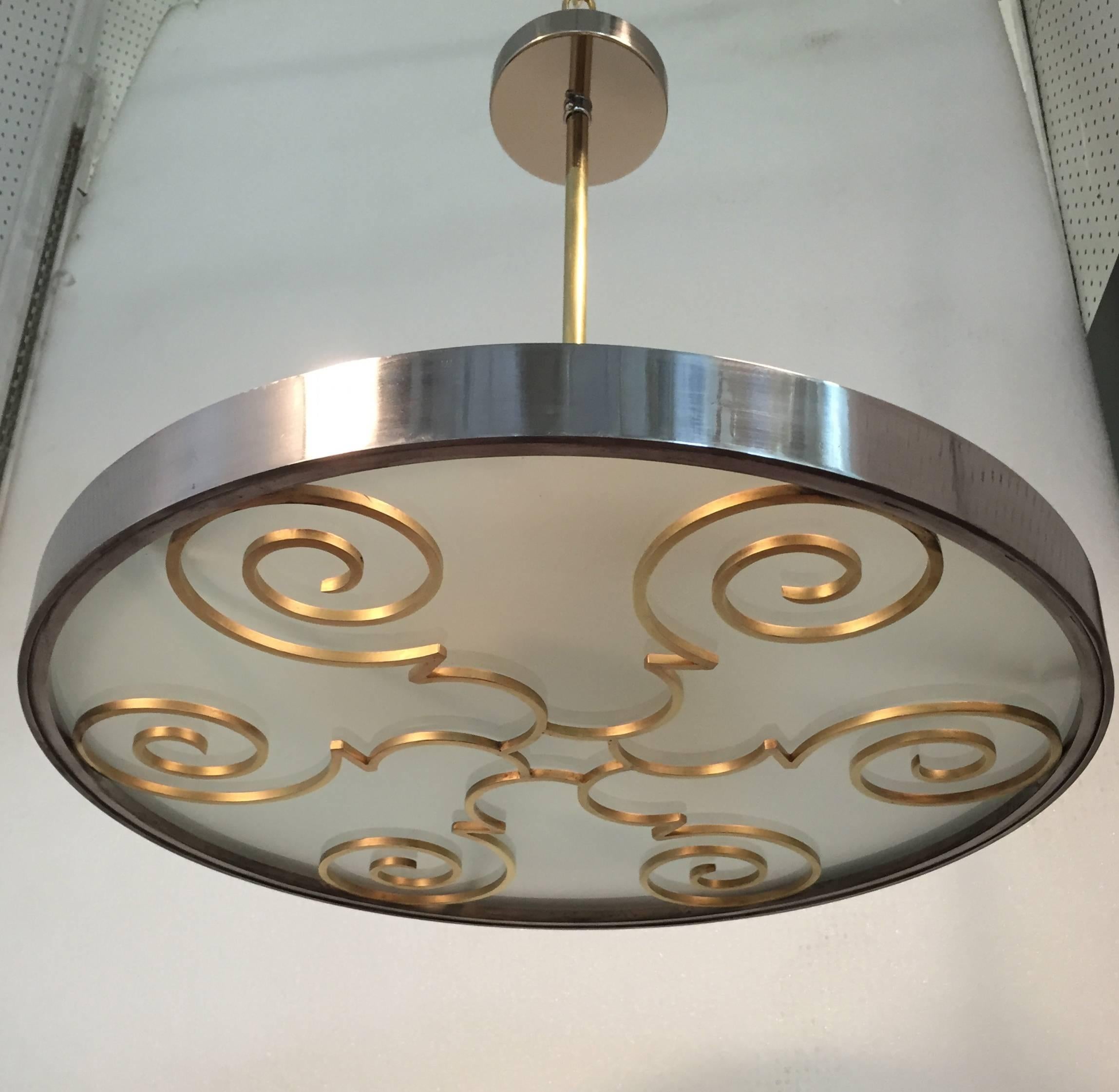 A chandelier by Lars Holmstrӧm for Arvika Konsthantverk,
circa 1930s.
Glass, brass and steel. Three lamp holders with Edison sockets.
Newly rewired. Can be mounted with or without stem.
Measure: Diameter 22.2