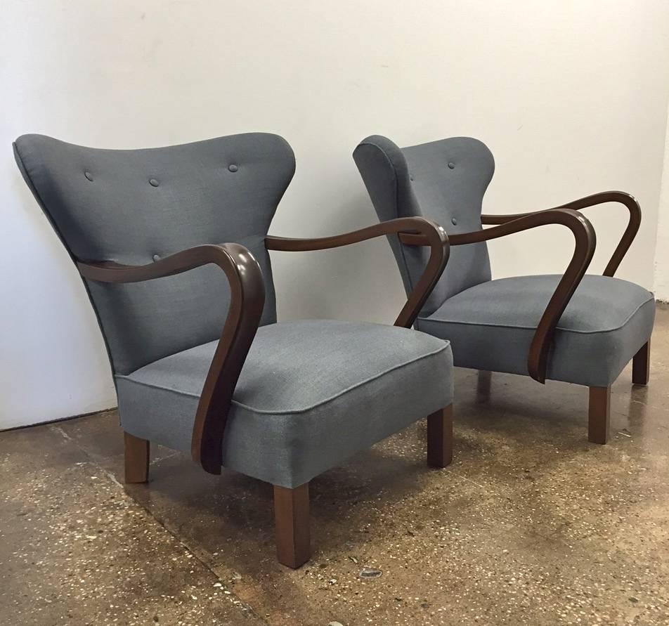 A pair of vintage Scandinavian low chairs. Probably Denmark, circa 1940s-1950s. Newly reupholstered in linen.
Measures: 29