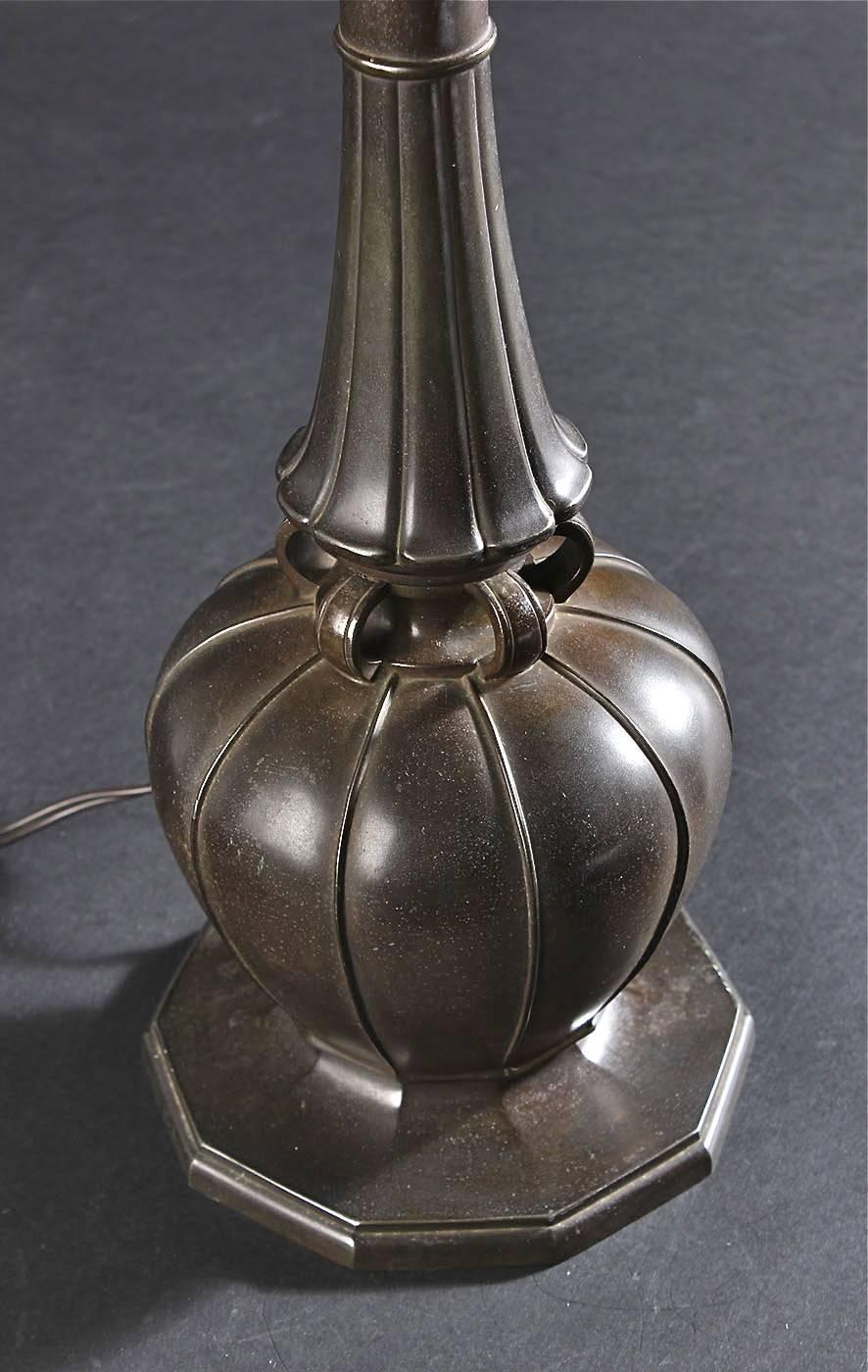 A large table lamp by Just Andersen, Denmark, circa 1930.
Patinated disco metal, marked: Just Denmark 2239.
Existing European wiring, rewiring available upon request.
The metal base height is 14