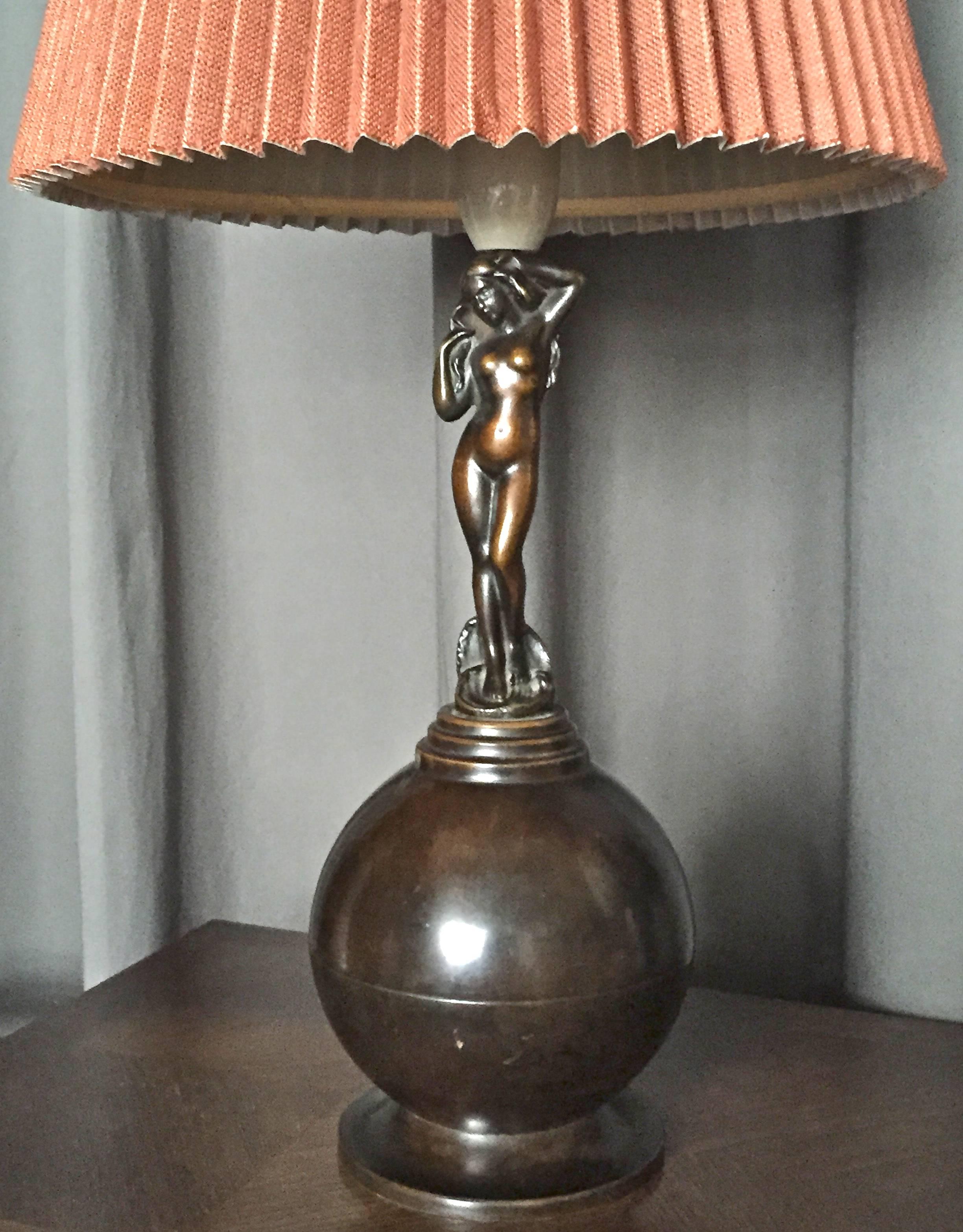 An Art Deco style, patinated bronze table lamp by AE Bronze, Denmark, circa 1930s.
Patinated bronze, marked by manufacturer. Measures: H-21