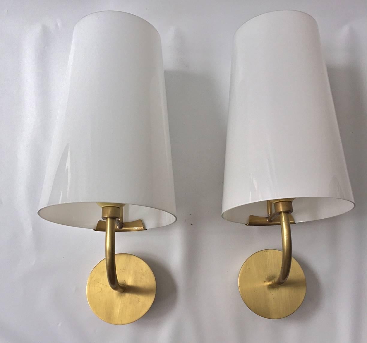 A pair of wall lights by Fog & Mørup, Denmark, circa 1960.
Brass hardware with opal glass shades.
The matching double head wall lights also available.
Existing electrical wiring, we do not guaranty functionality. Rewiring available upon request.