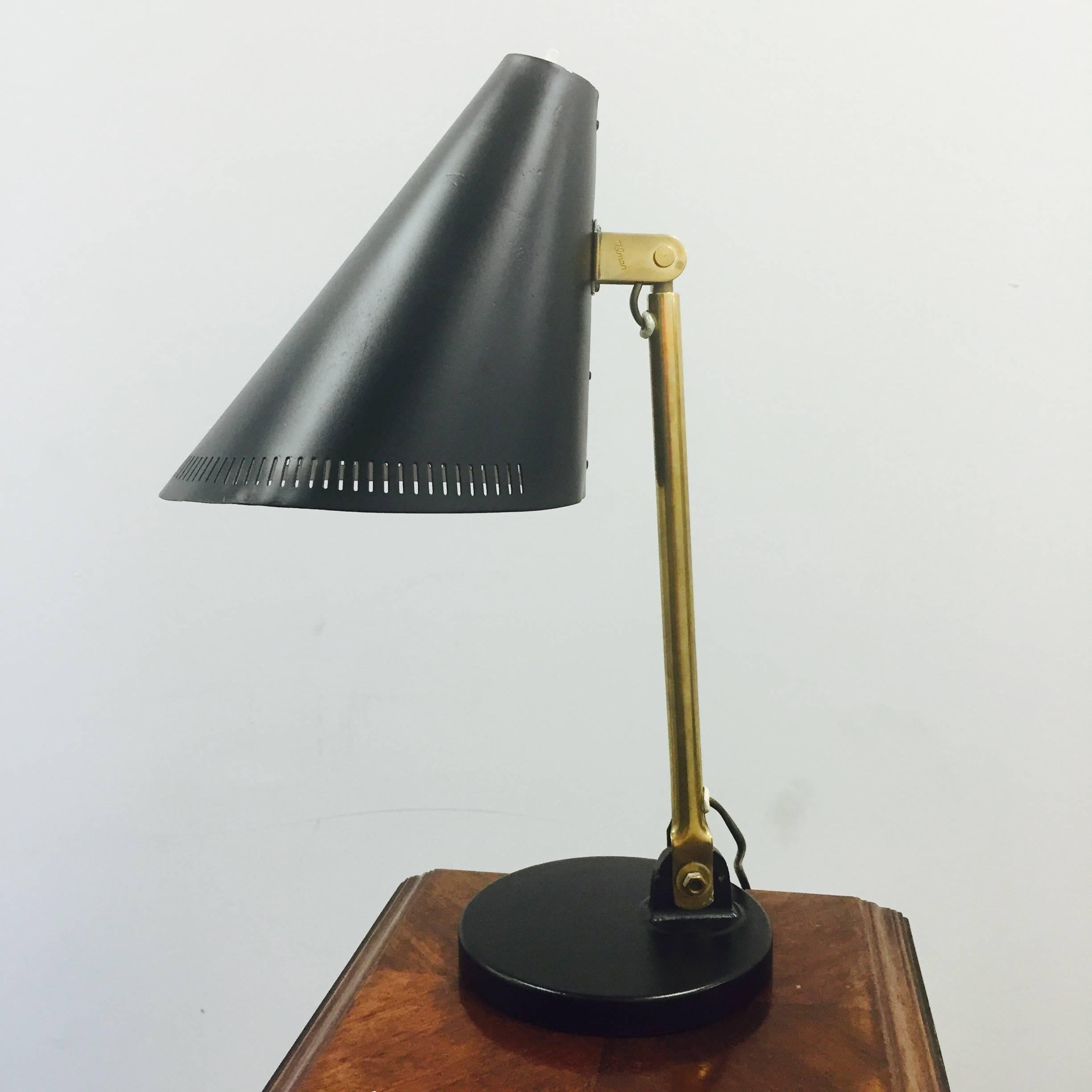 A table lamp designed by Paavo Tynell for Idman, Finland, circa 1950.
Marked by manufacturer.
Later painted shade and base.
Existing wiring, we do not guaranty functionality, rewiring available upon request.
      