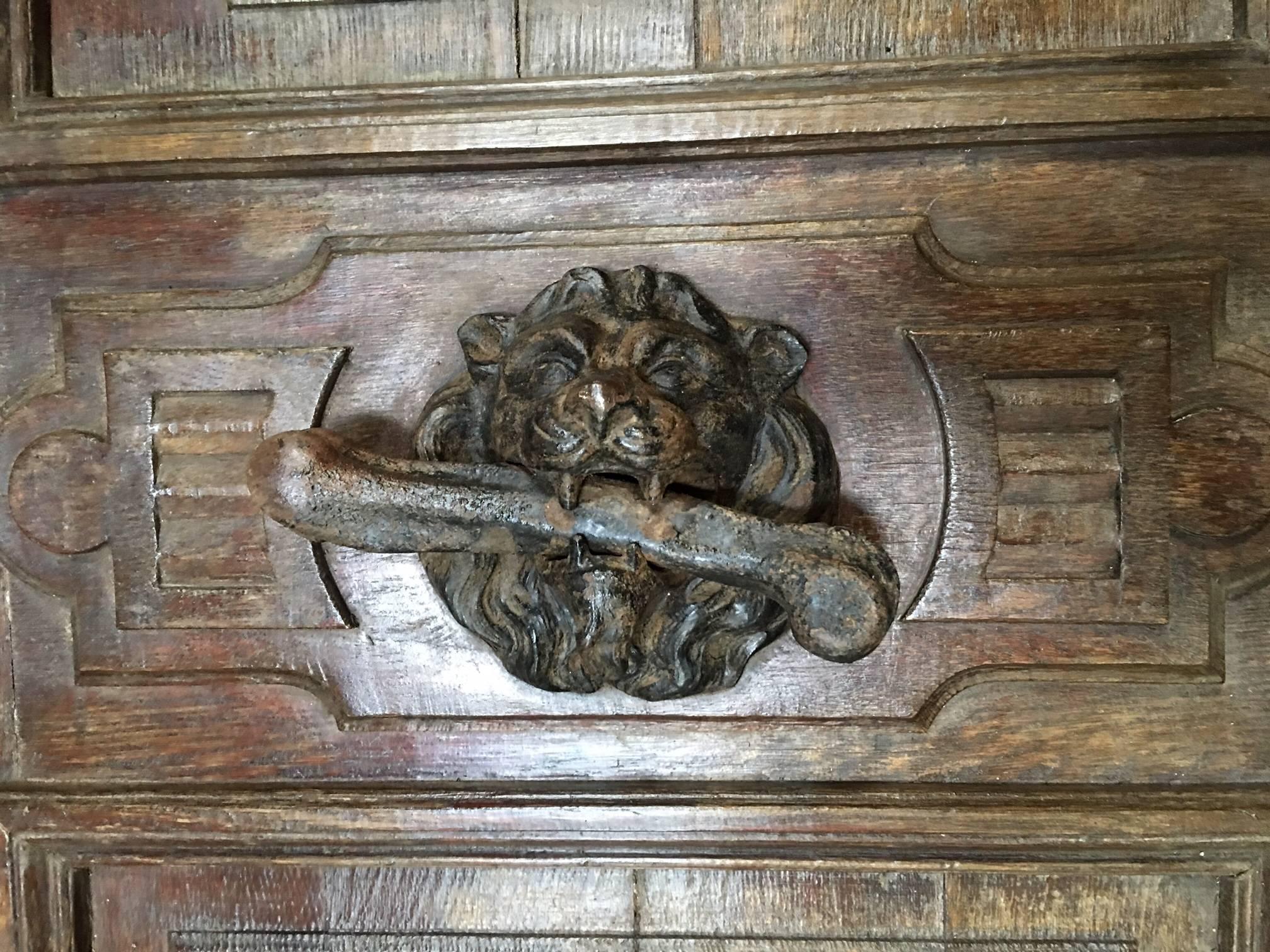 This massive antique French door with frame features a fantastic lion door knocker and makes for a very impressive entrance.

 Origin: France.

 circa 1820.

 Measurements: 10'2