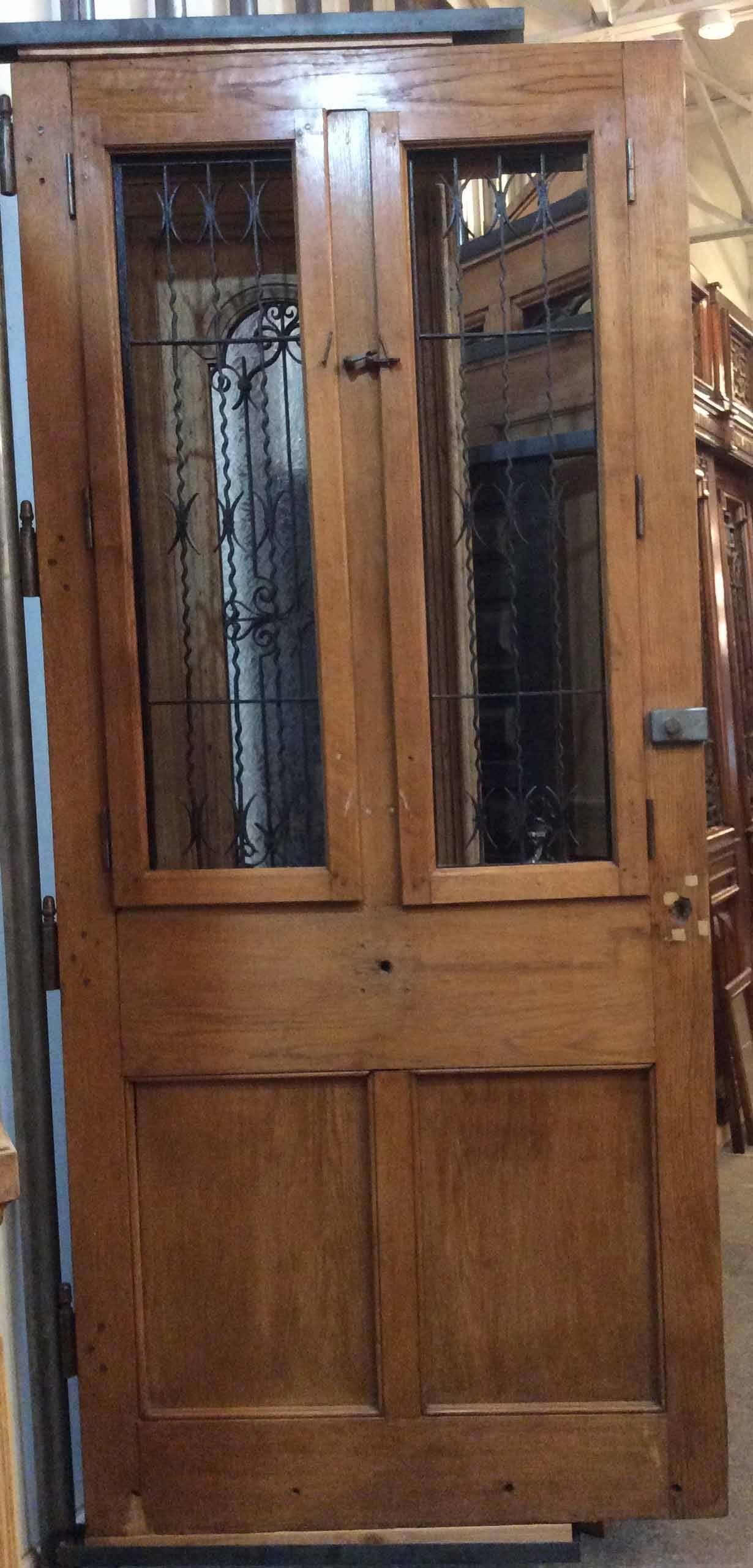 Single French oak door with ironwork features two raised panels.

 Origin: France,

 circa 1870. 

Measurements: 99