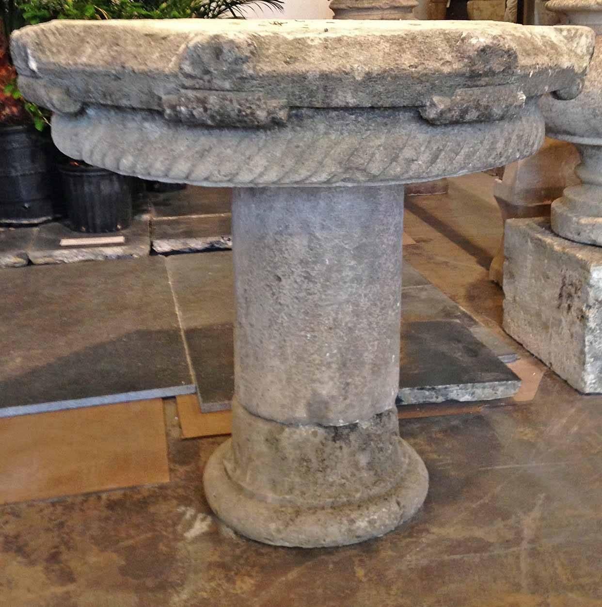 Add character to your garden, porch or terrace with this charming French pedestal table from France, circa 1550. Rustic yet refined, this carved limestone antique is absolutely charming. From the tabletop to the base, the circular table shows a