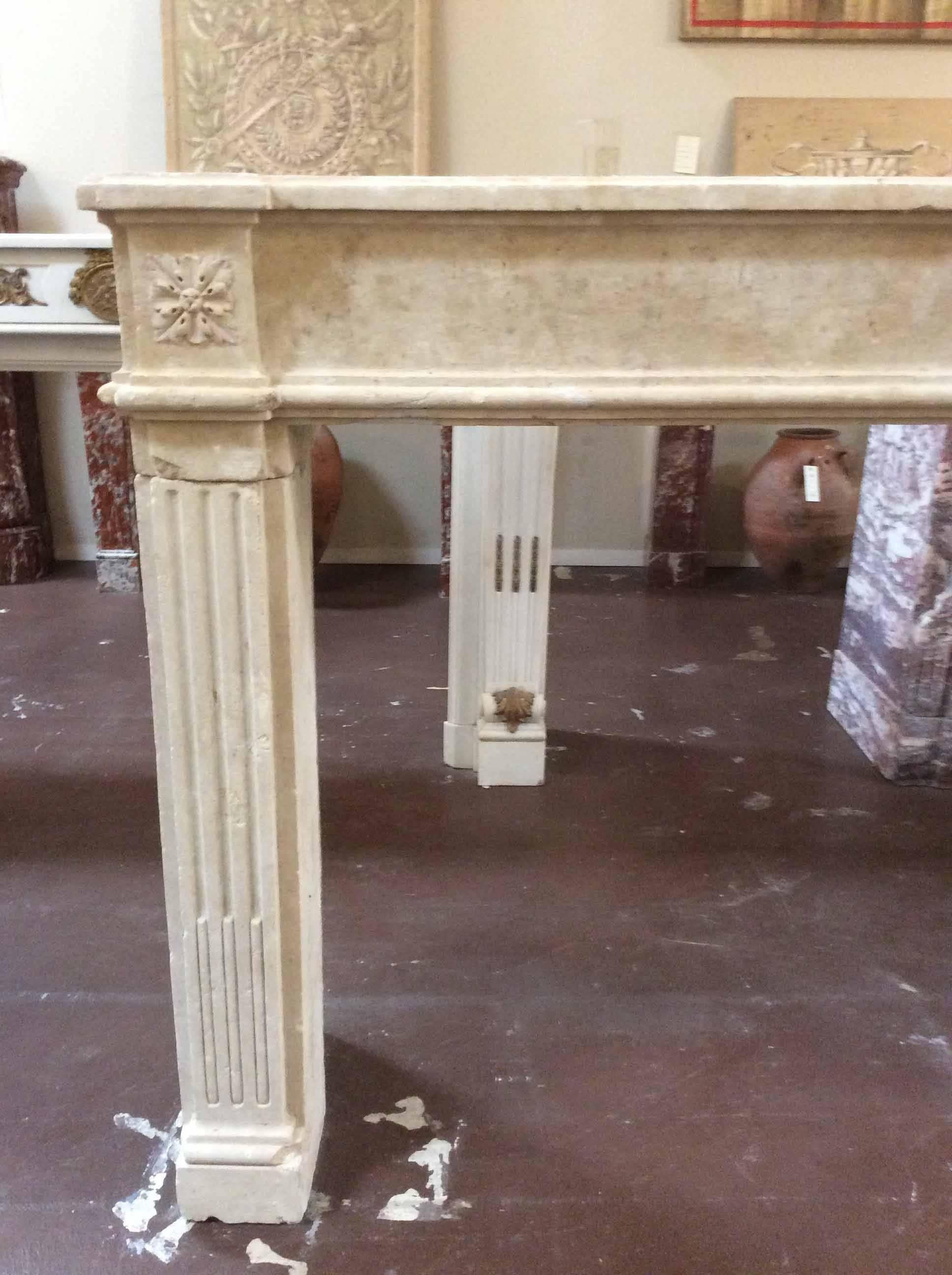 For a classic, beautiful mantle, look no further than this limestone mantle from France circa 1750. The mantle is simple in shape with discrete, carved details that would make it a lovely addition to living room, dining room or bedroom in any home.