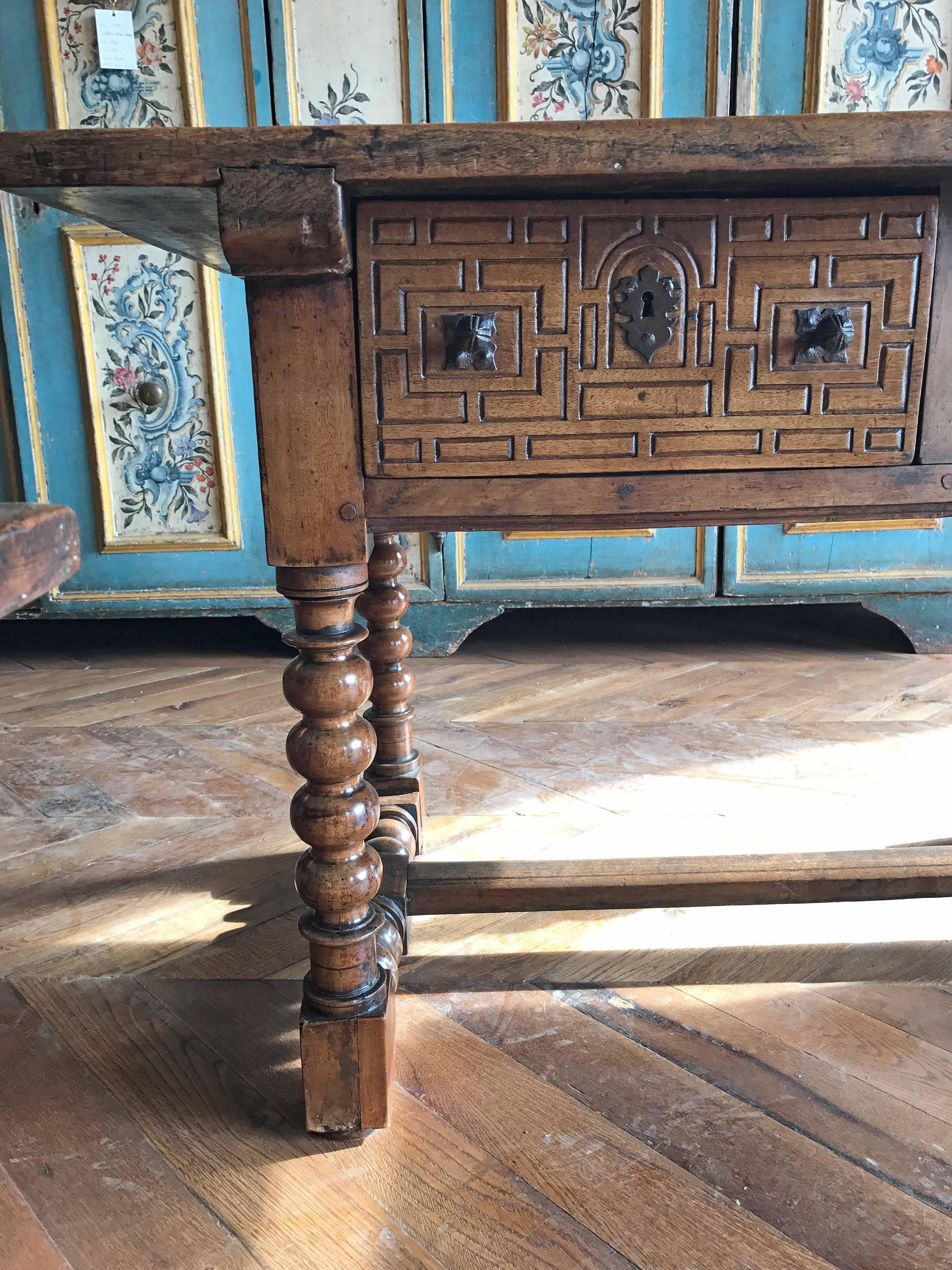 This antique Spanish side table features wonderful inlay design and barley twisted legs. Origin: Spain, circa 1800s. Measurements: 50