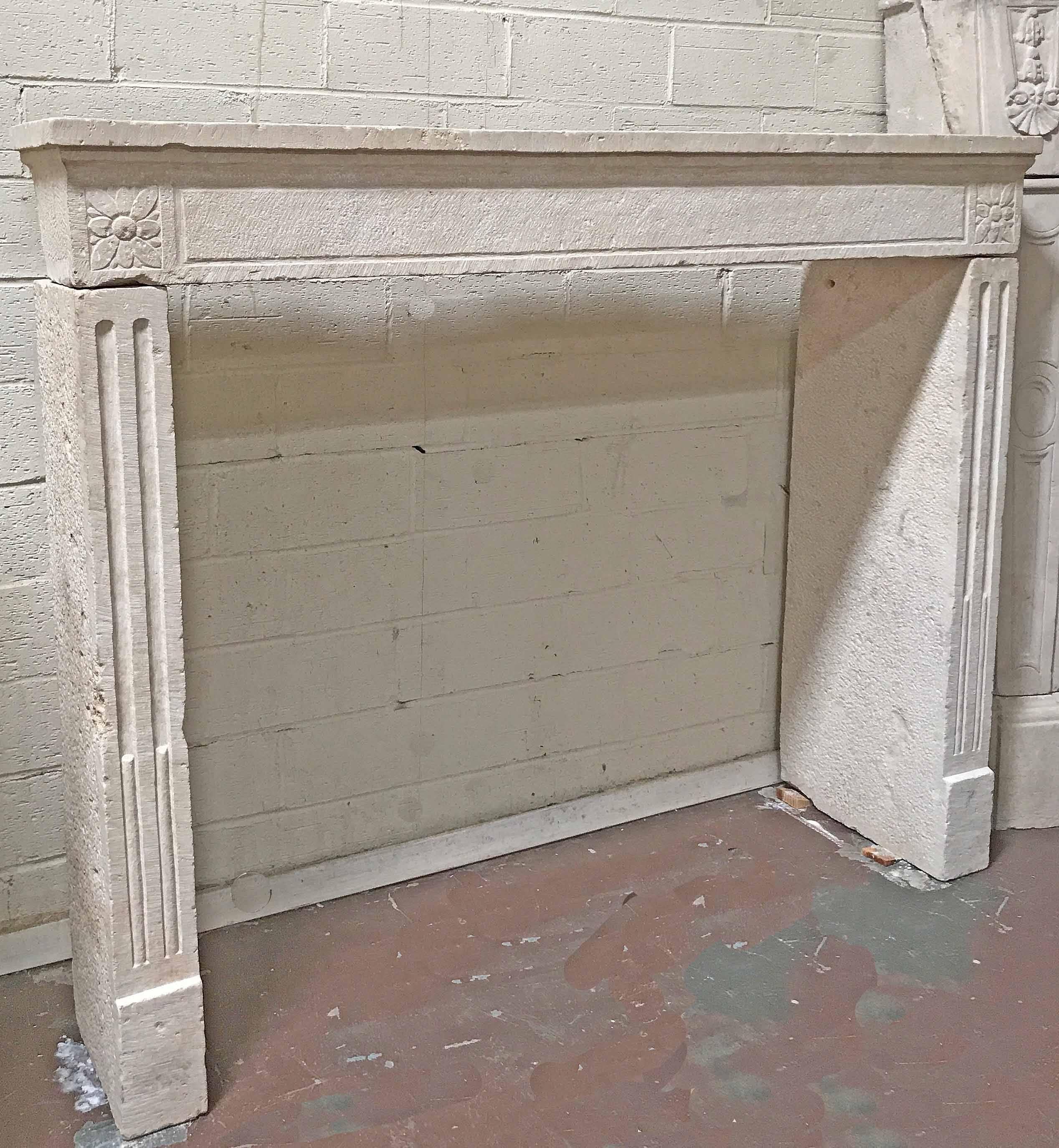 18th century limestone mantel features fluted legs and a floral motif on each end of lintel.

Origin: Valley de la Loire, France, 

circa 1790

Measurements: 56 1/2