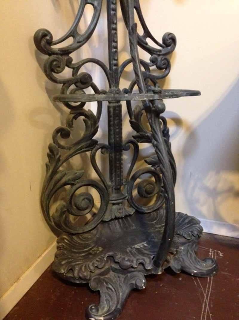 Here we have a quaint iron hall tree with a small oval tilting mirror. 

Origin: France

 