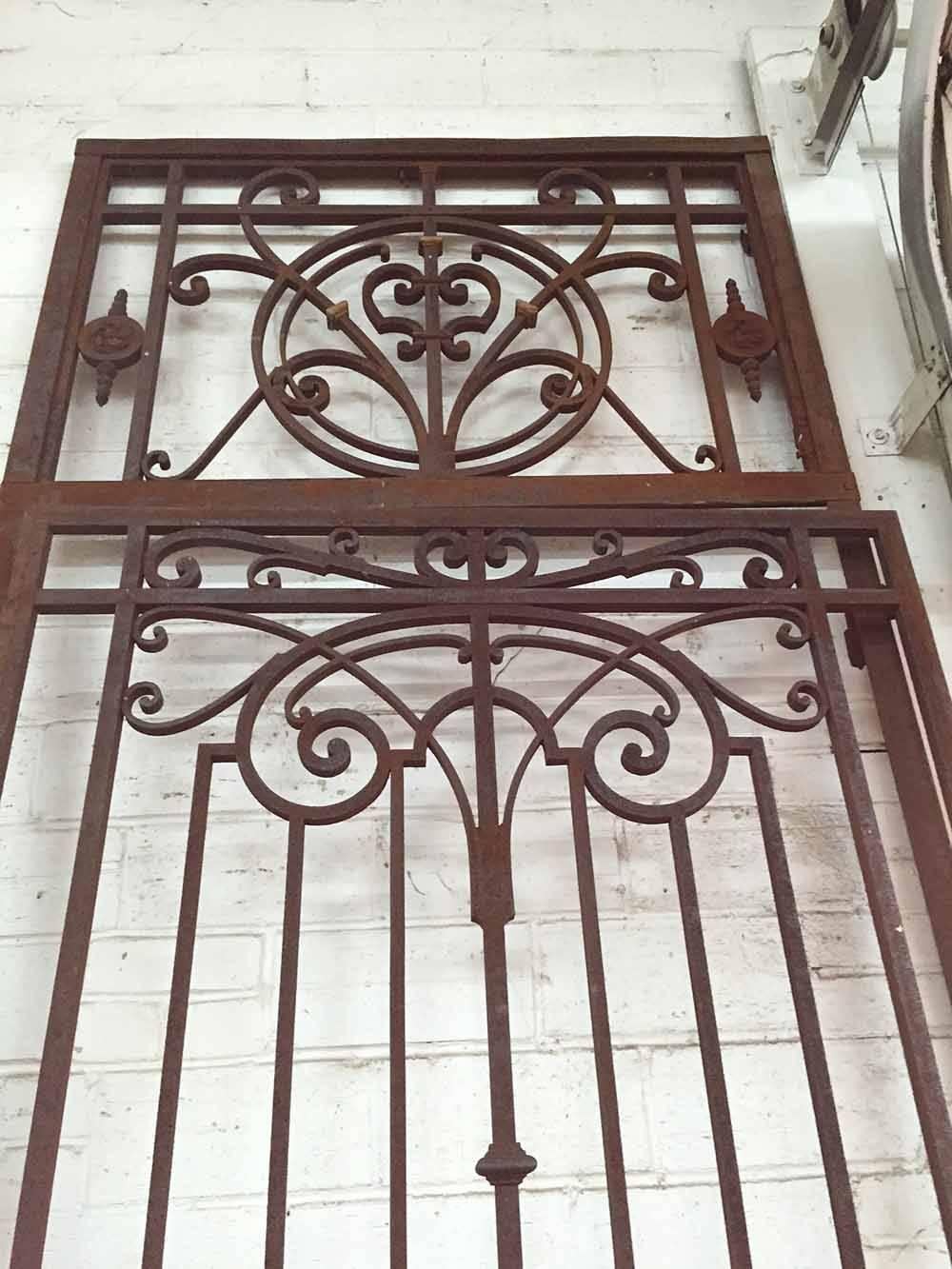 Imported from France, this antique iron gate includes a mail slot and a transom.

Origin: France

circa 1890