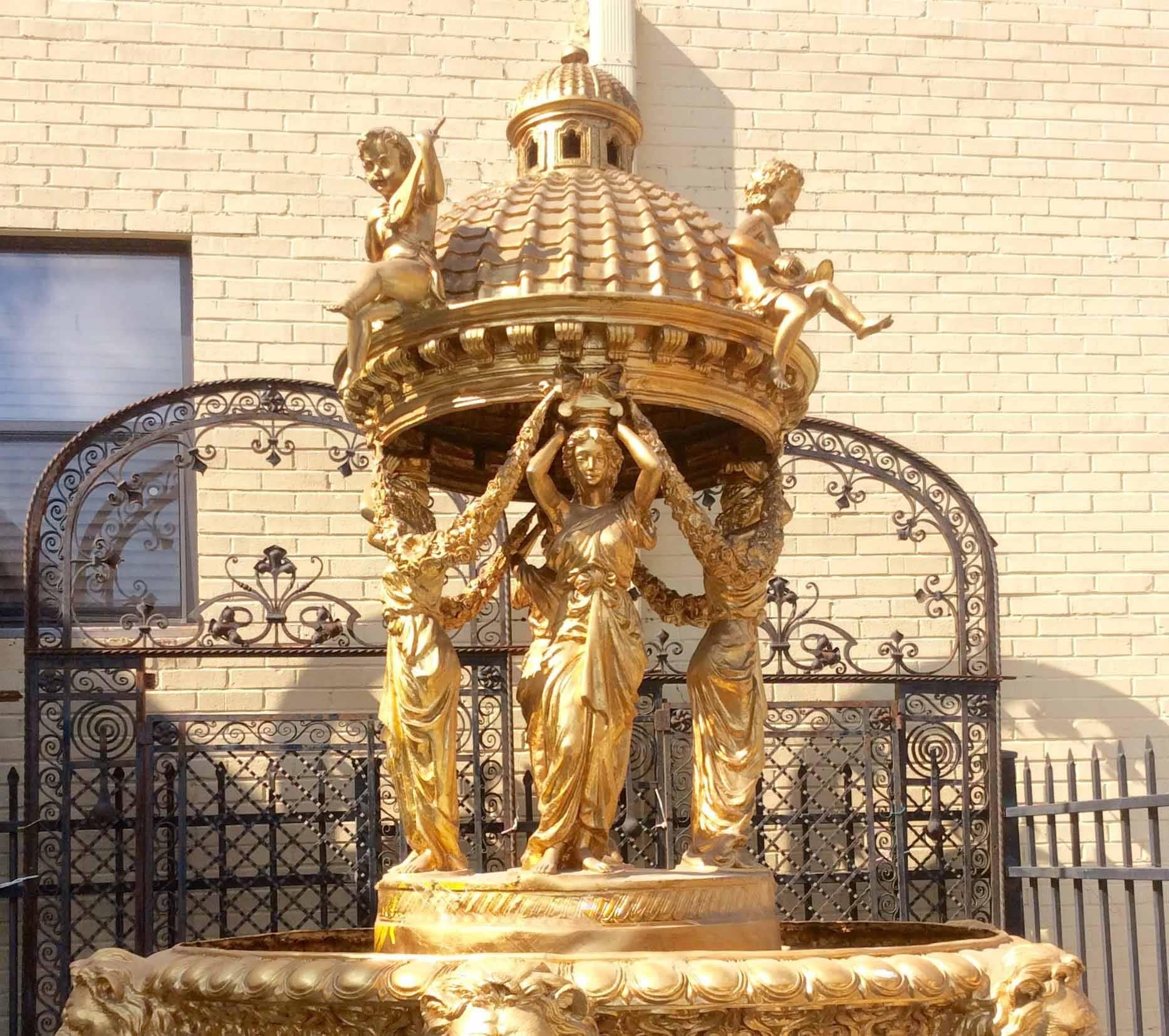 Gilt bronze fountain features lion's heads, women and children playing instruments.

Received from the Win Star Casino, Ada, Oklahoma,

Measurements:
6' D x 11' H.