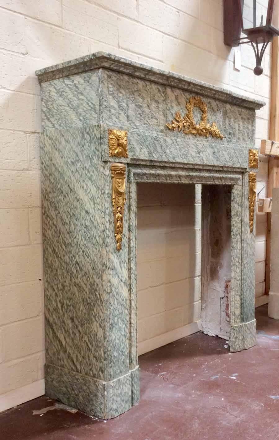 This empire marble mantel features a fluted lintel and bronze accents. Nice clean lines and wonderful movement! 

Origin: France, 

circa 1870. 

Measurements: 42 1/4