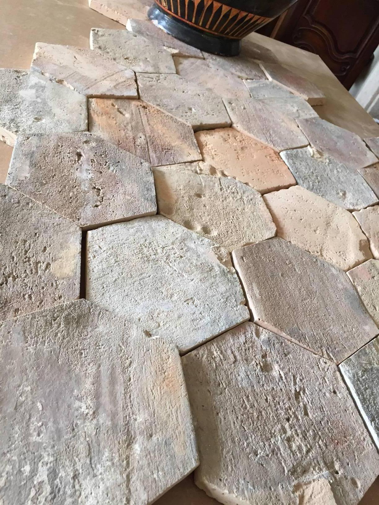 For a warm, rustic, Mediterranean look indoors or outdoors, look no further than our antique terracotta tiles. Crafted in France circa 1750, these classic tiles are each a hexagon shape. The ceramic flooring has a geometric pattern and a discrete