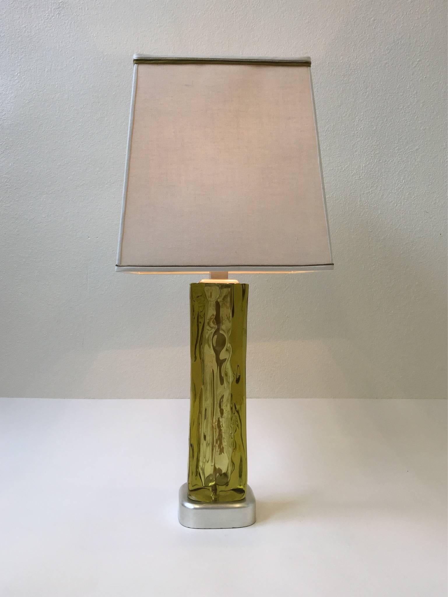 A glamorous Murano glass and silver leaf table lamp by Marbro. The Murano glass has some strokes of gold. The custom white linen shade is original.
 Newly rewired and it has a rotating three way switch on the base. 
Dim: 16.5