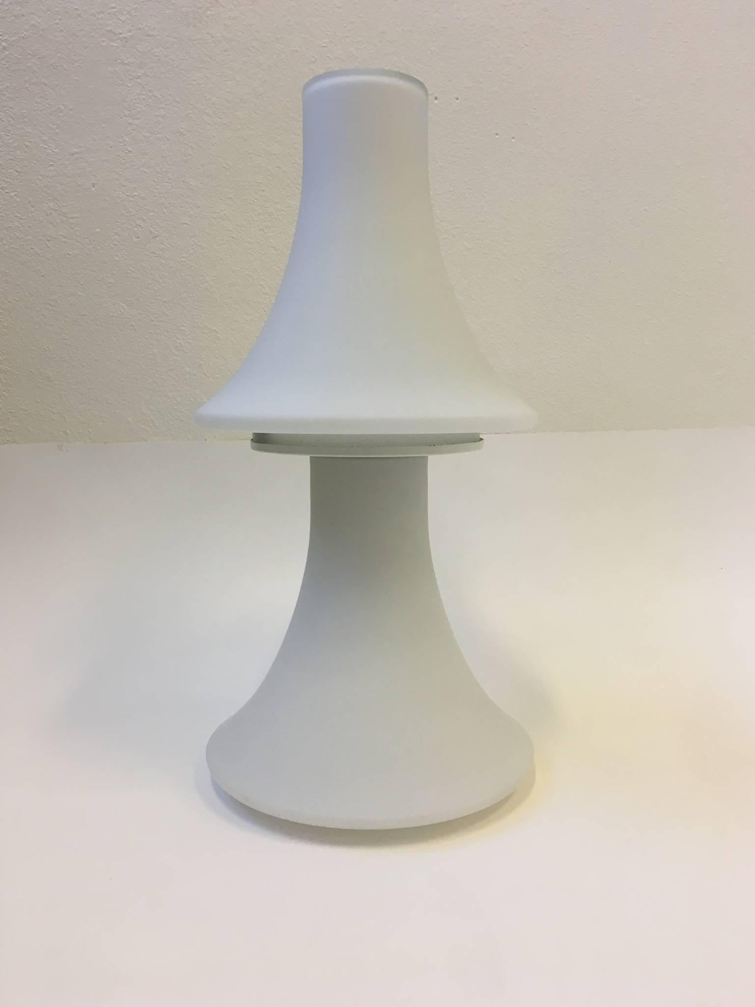 A rare sculptural shape white frosted glass table lamp, designed in the 1960s by Laurel Lamp Company.
The lamp has been newly rewired with a full range dimmer control on the wire. 
The lamp takes two regular Edison light bulbs. One for the base
