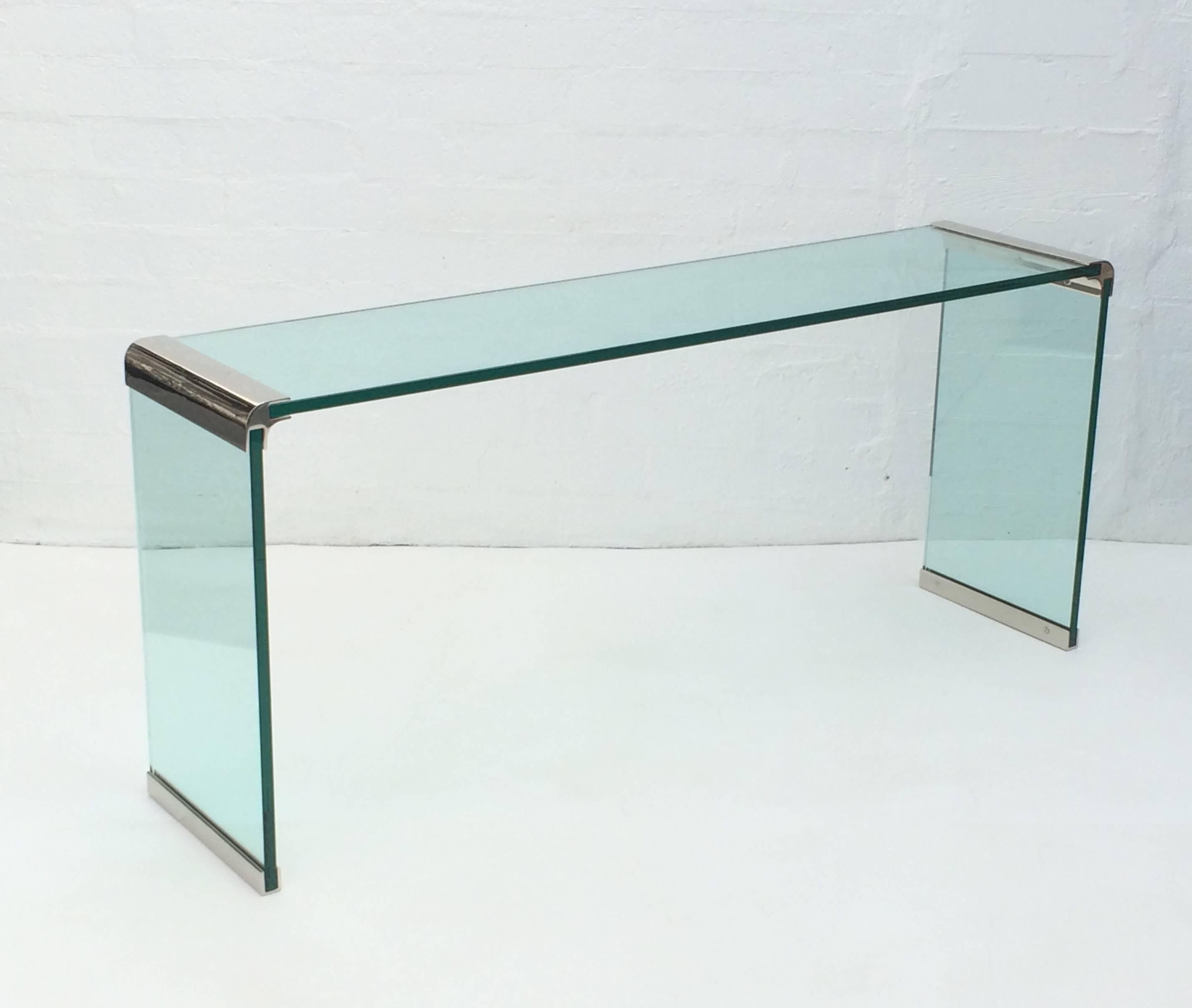 An elegant waterfall console table designed by Leon Rosen for Pace Collection in the 1970s.
Newly re-plated in nickel and all new 3/4