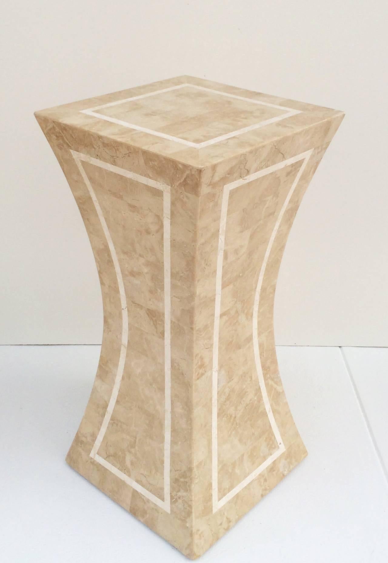 A polished tessellated fossil stone and marble pedestal by Maitland-Smith.