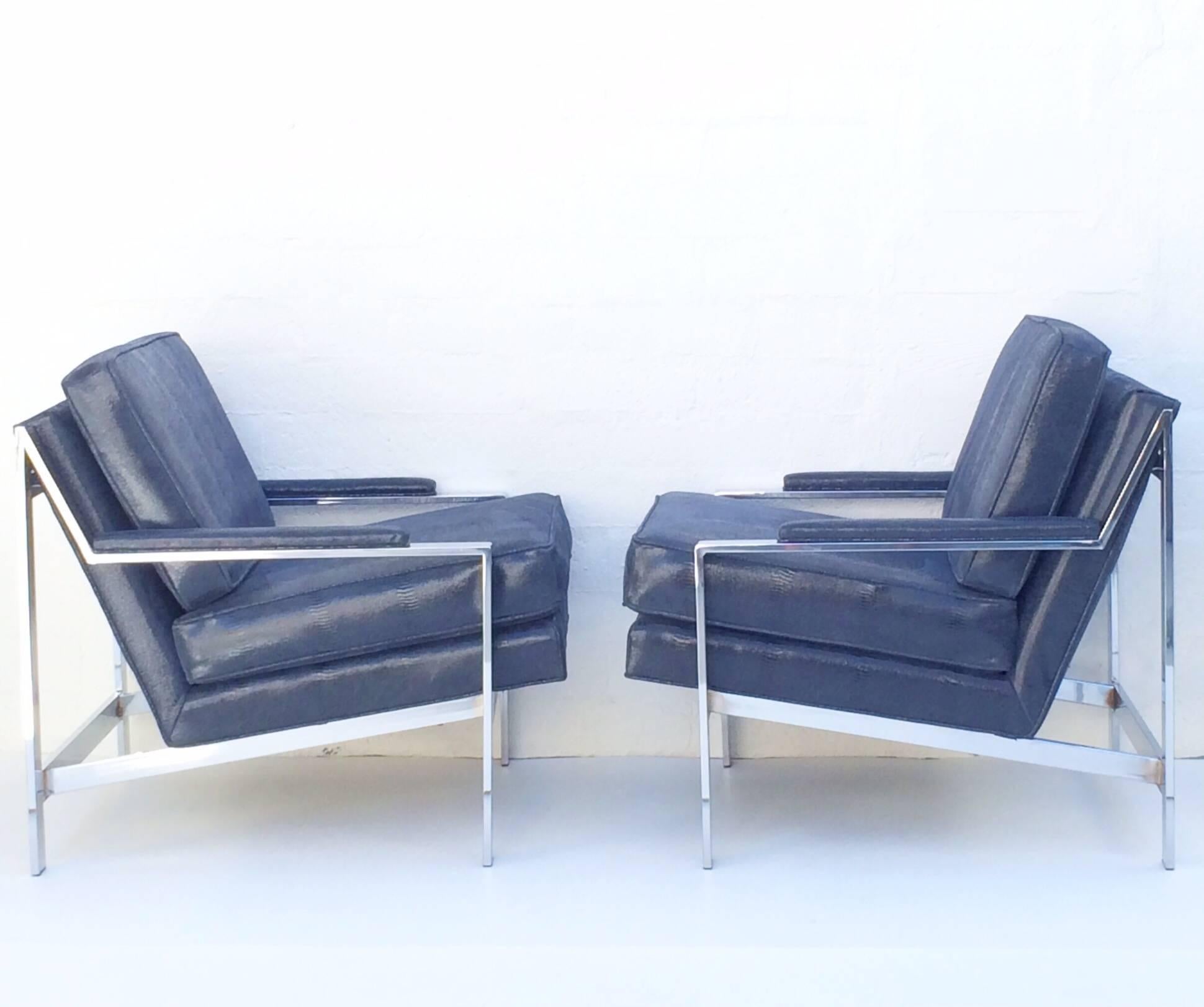 Stunning pair of polished chrome and leather lounge chairs designed by Cy Mann. 
Newly reupholster in a sexy midnight blue faux snakeskin leather.