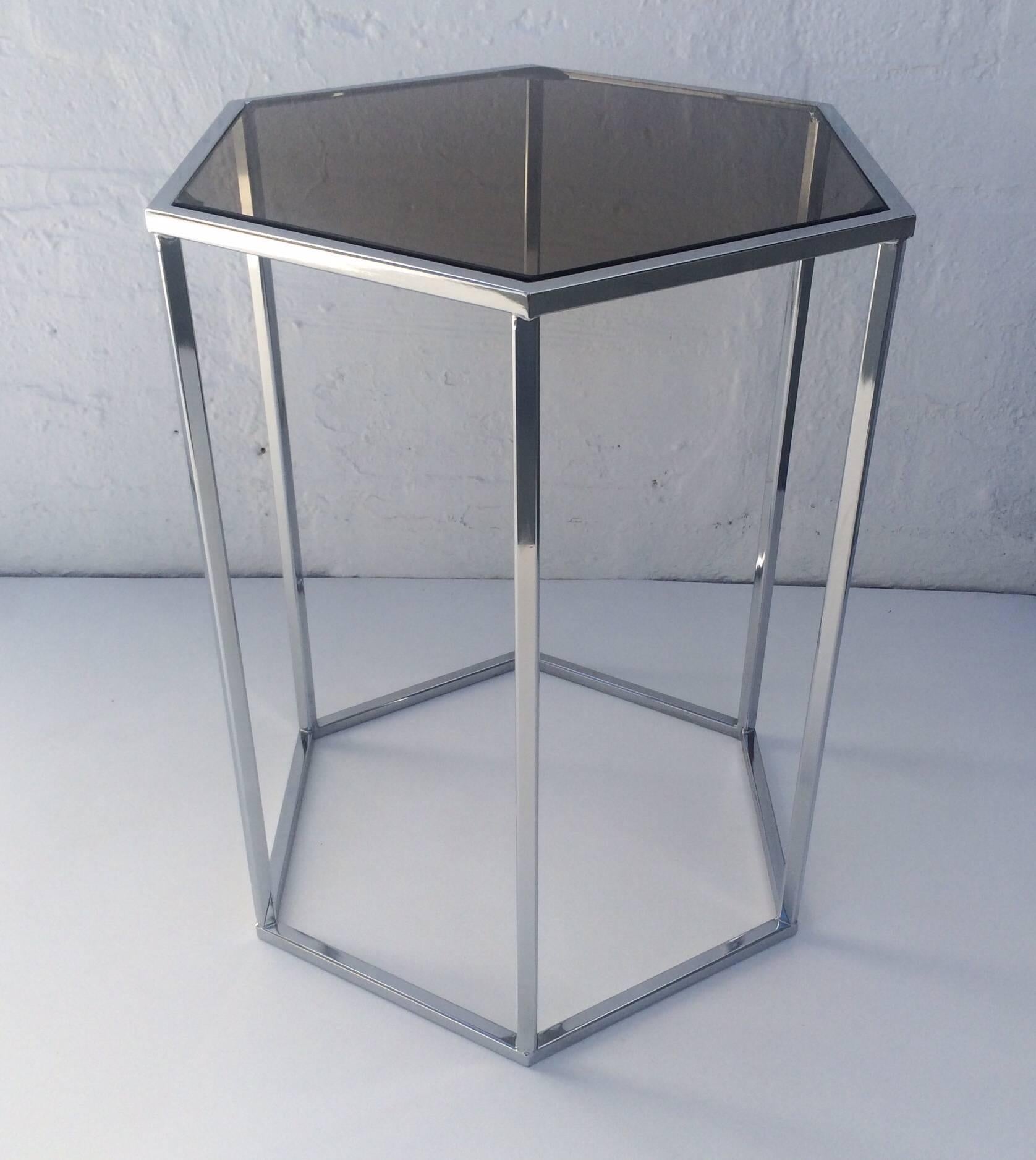 Hexagon side table designed by Milo Baughman, circa 1970s. 
Polished chrome hexagon base with a inset smoked glass top.
