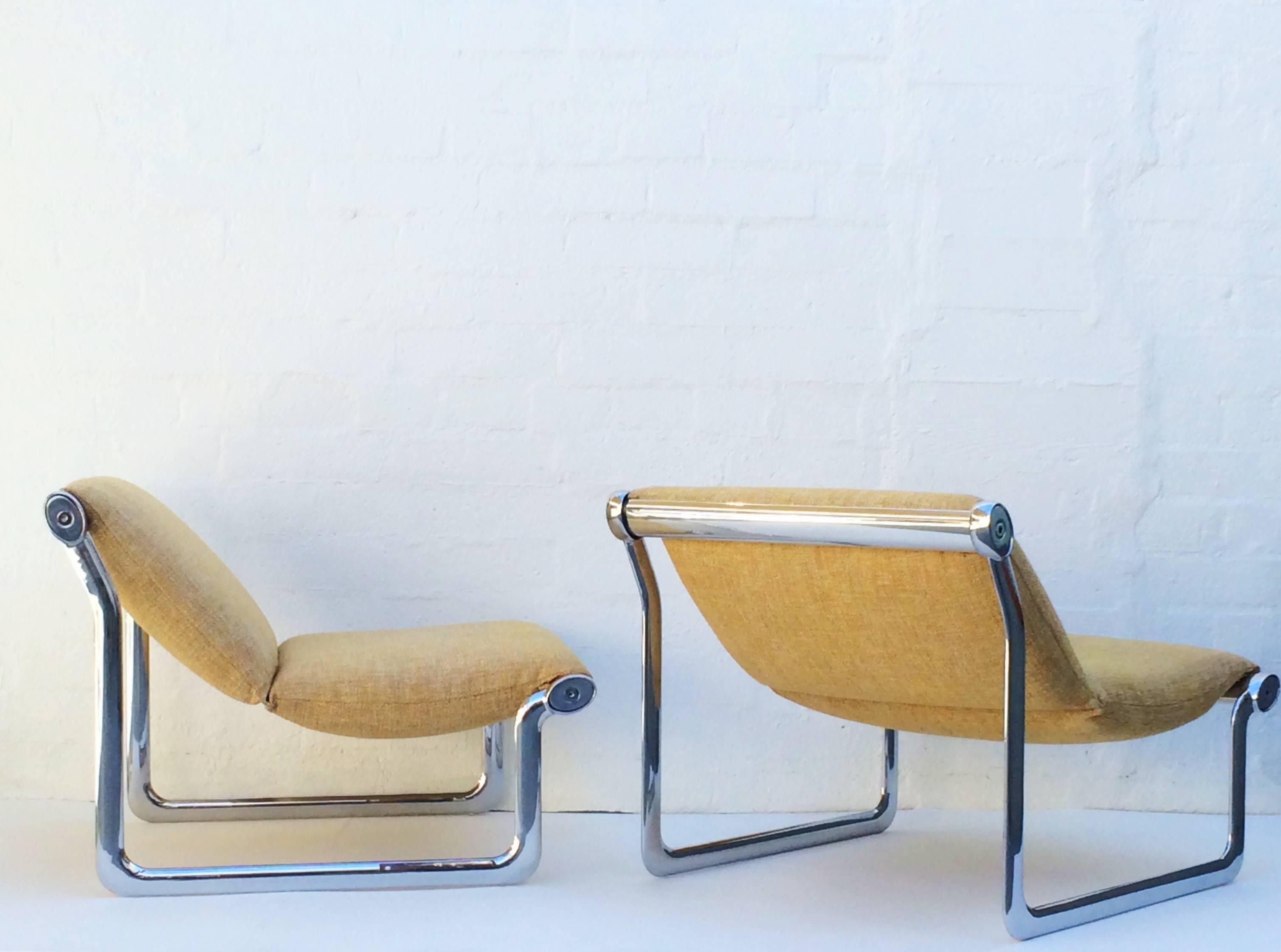 Rare pair of sling lounge chairs designed by Hannah Morrison for Knoll International.  
These chairs consist of newly professionally polished aluminum frames that support the sling style seating newly upholstered in a light dandelion yellow Knoll