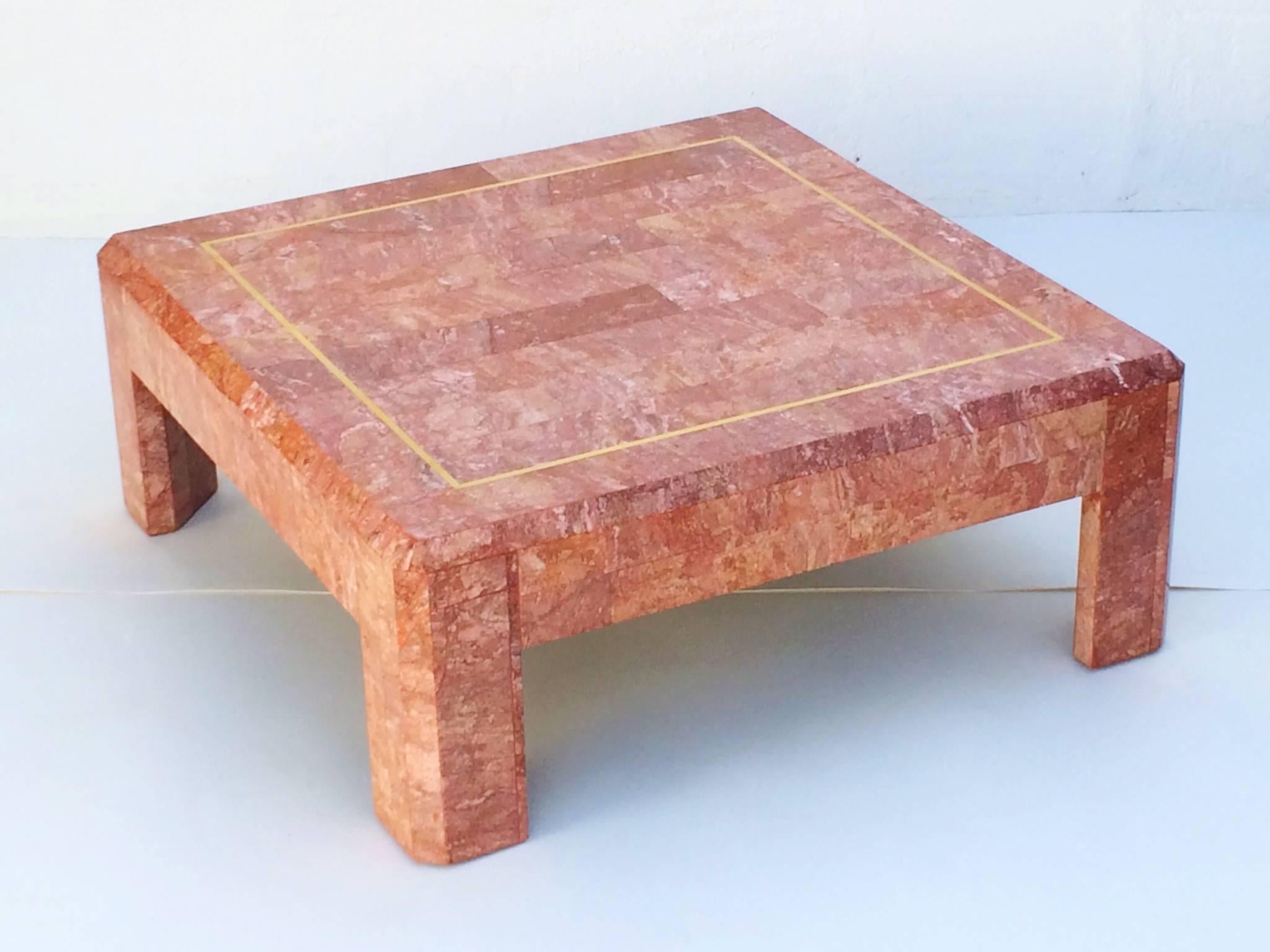 Large coffee or cocktail table by Maitland-Smith,
circa 1980s. 
 Beautiful tessellated Rosso marble with brass inlay accents.