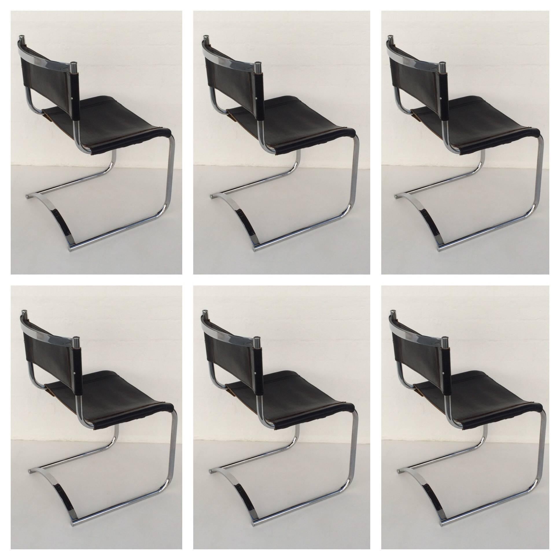 Rare set of six polished chrome and black saddle leather dining chairs designed by Cy Mann.
