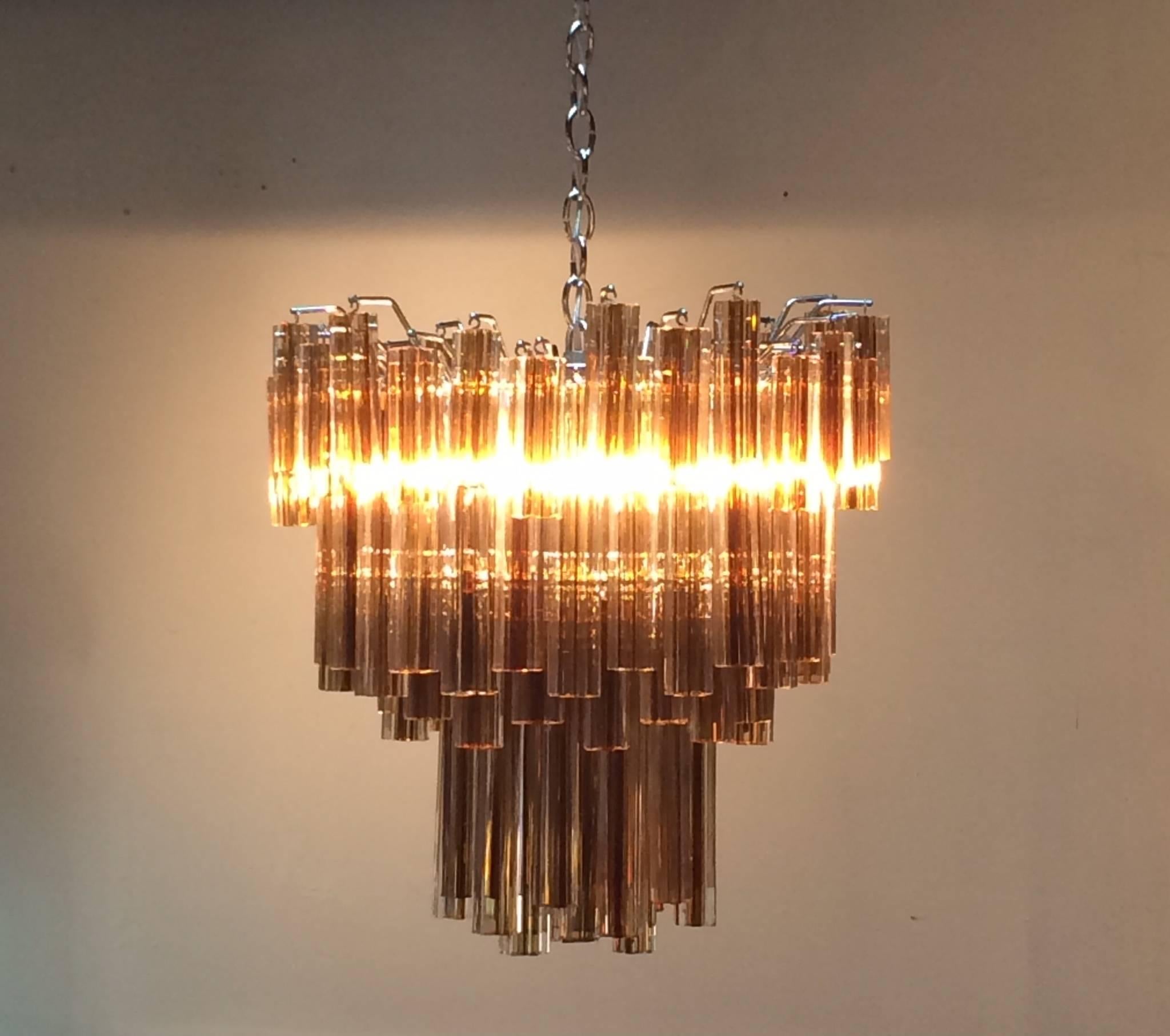 A ten-tier Murano chandelier designed by Venini for Camer. 
Consist of very unusual flower shaped prisms that are clear with Amber in the center of the flower creating an interesting glow when lit. 
Newly re-wired.