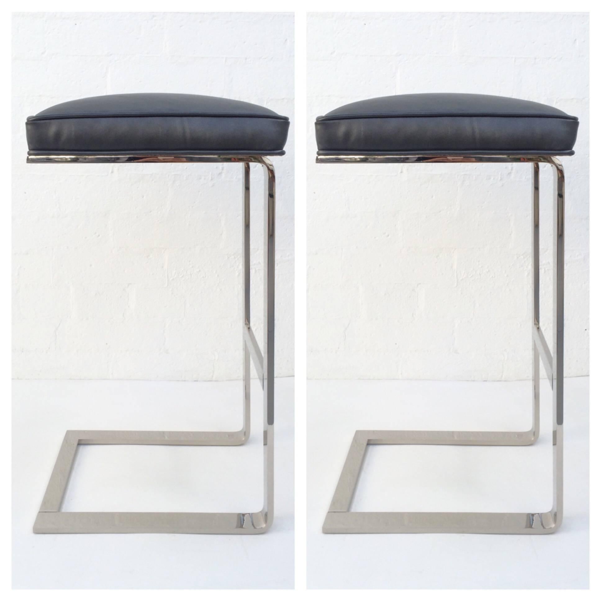 Pair of nickel-plated Barstools designed by Milo Baughman.
Newly re-plated nickel and newly reupholstered in a charcoal gray leather with a slight sliver tone.