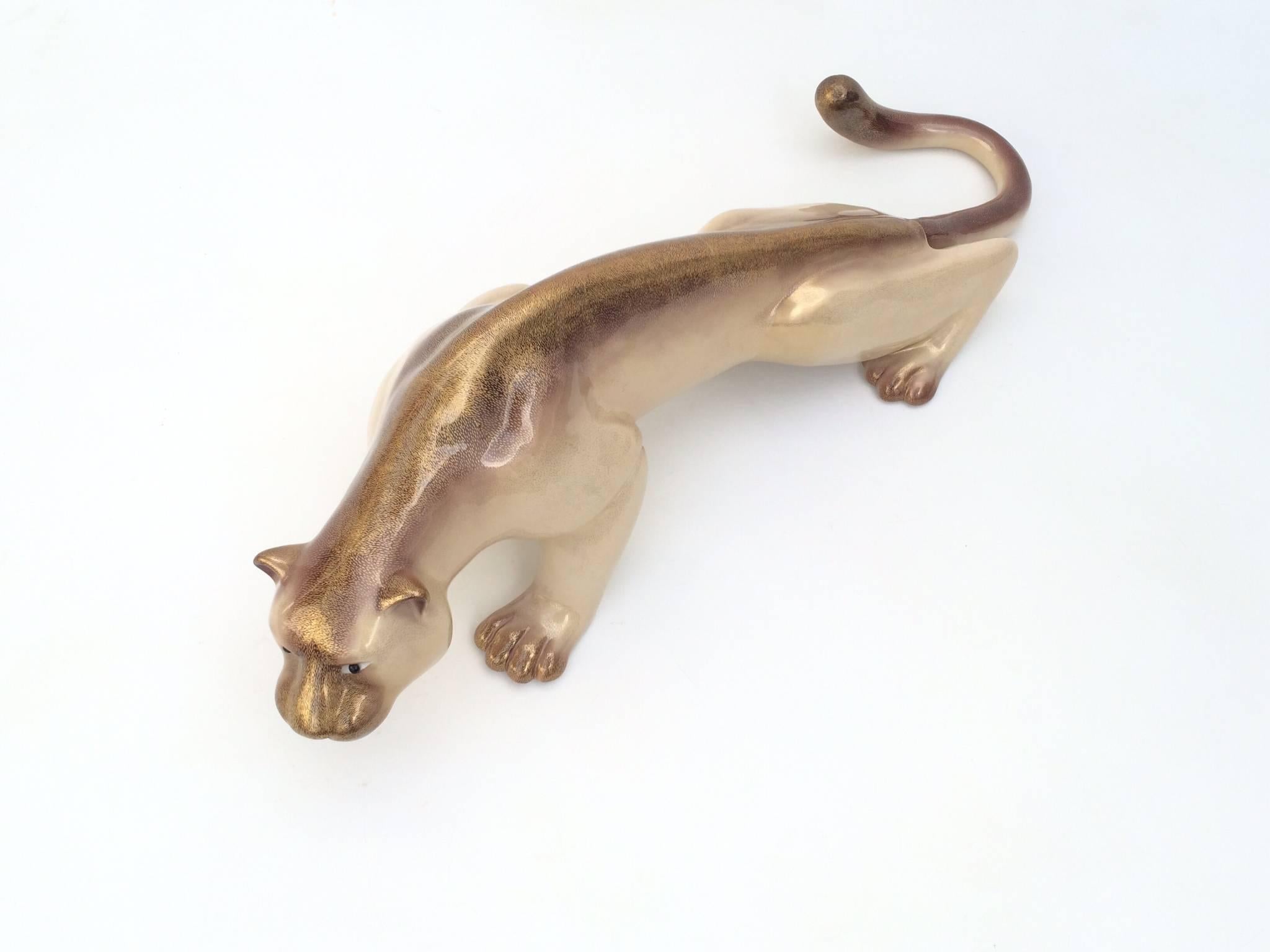 A very large-scale gorgeous Italian porcelain mountain lion designed by Giulia Mangani and made for Oggetti.
Wonderful lifelike details with beautiful hand-painted gold tones.
Signed on the back right leg (see photos).
     
