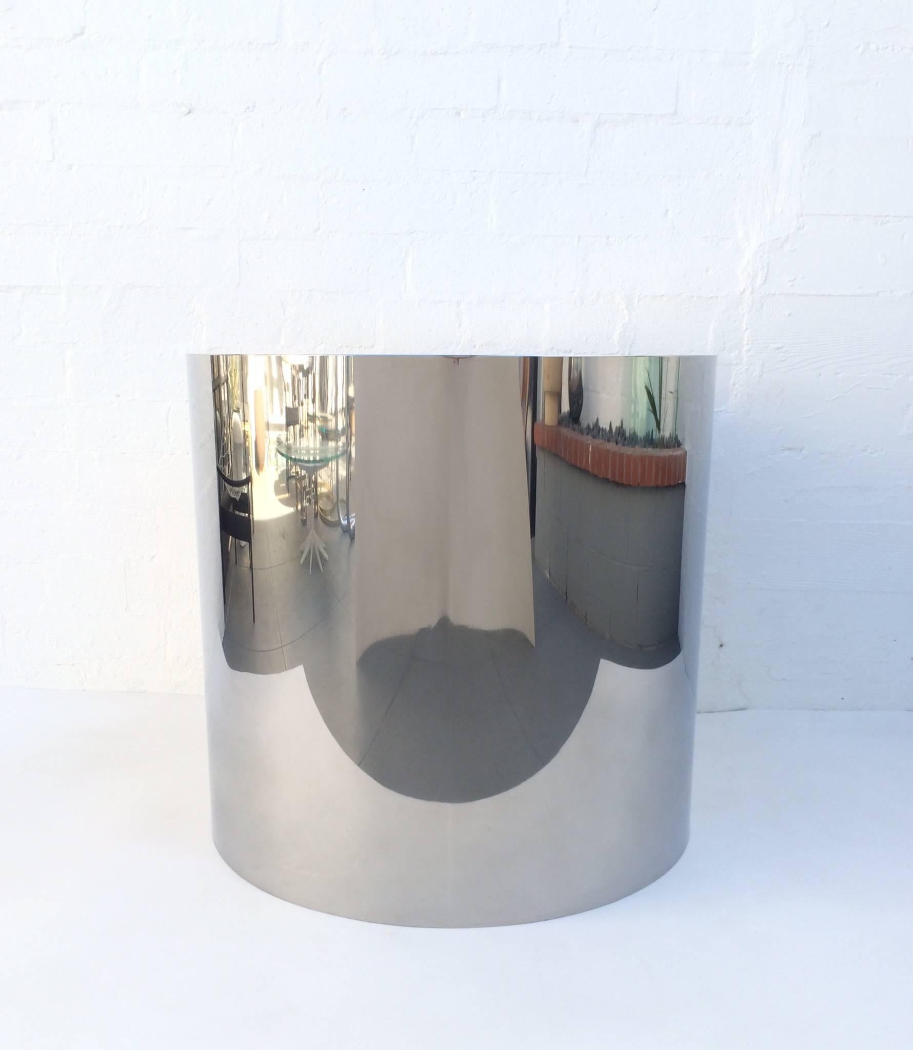 Stunning polished stainless steel table base by Pace Collection. 
This cylinder base is seamless, has wonderful eye appeal and will make a statement.
It's large-scale can support a big glass top. 
We are selling this without glass, but can order