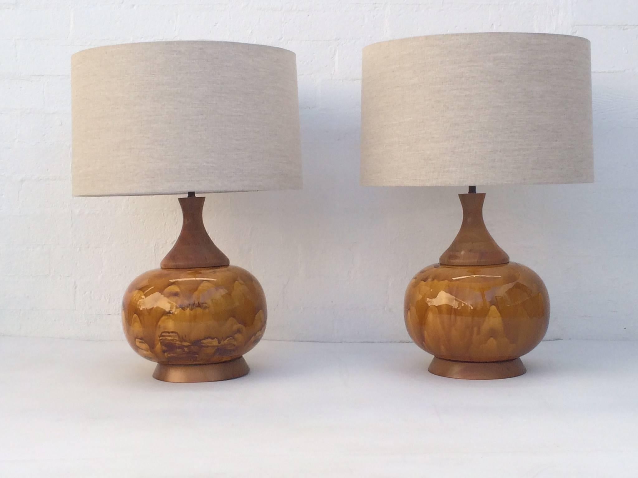 Pair of large-scale drip glazed ceramic lamps with walnut bases. 
These lamps are absolutely stunning!
Newly re-wired with new brass hardware.
New off-white linen shades, 
circa 1960s.