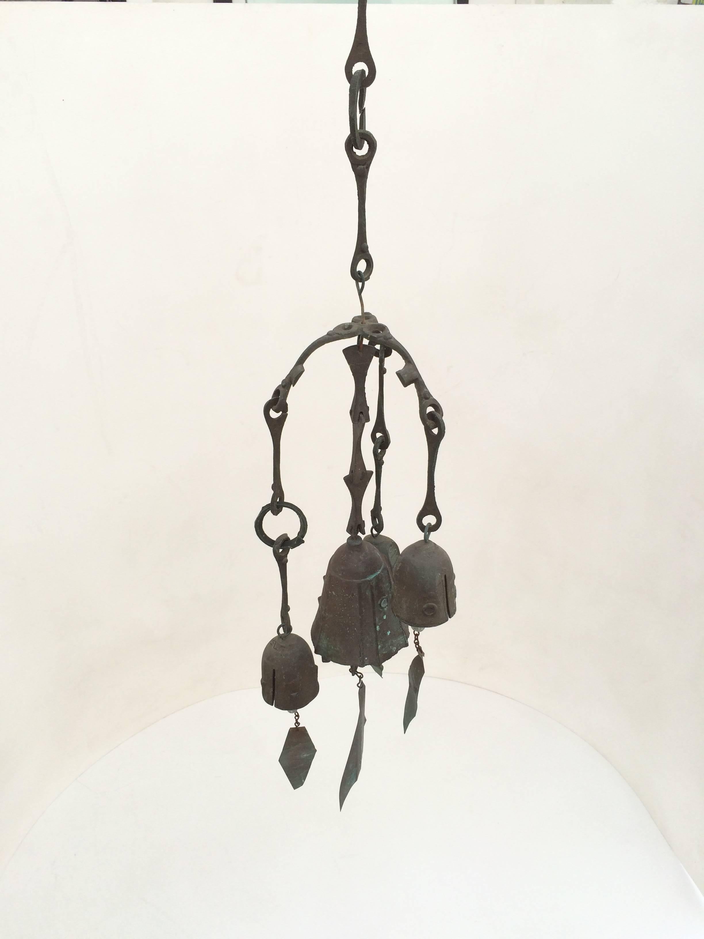 Multiple beautifully patina bronze wind bells that hang together by Paolo Soleri.
Consist of three smaller bells that are the same size and one large bell all hanging together that create a unique sound.
Larger bell retains the Soleri signature.