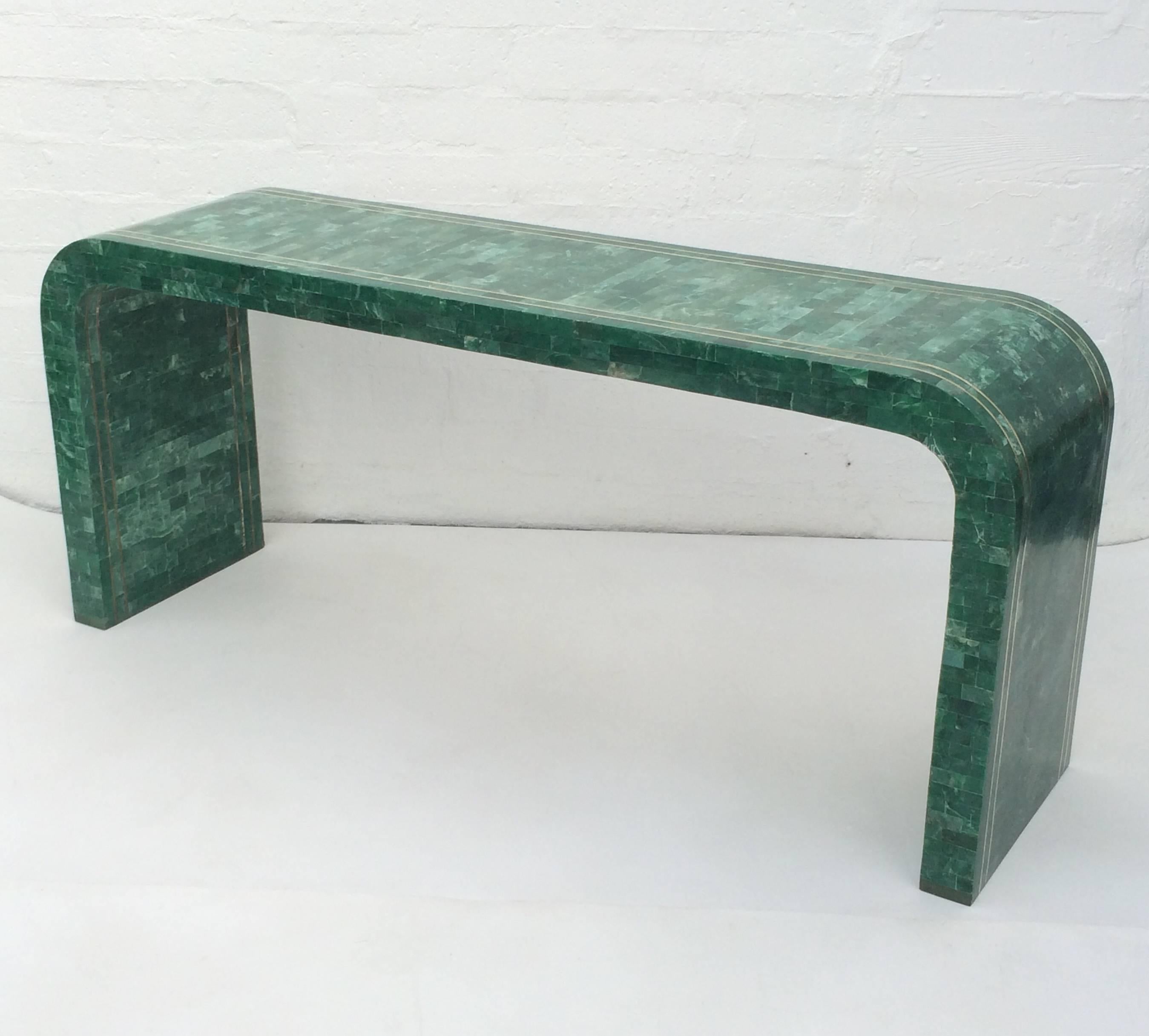 A glamorous waterfall console table with tessellated green marble and brass inlay. Newly professionally polished.