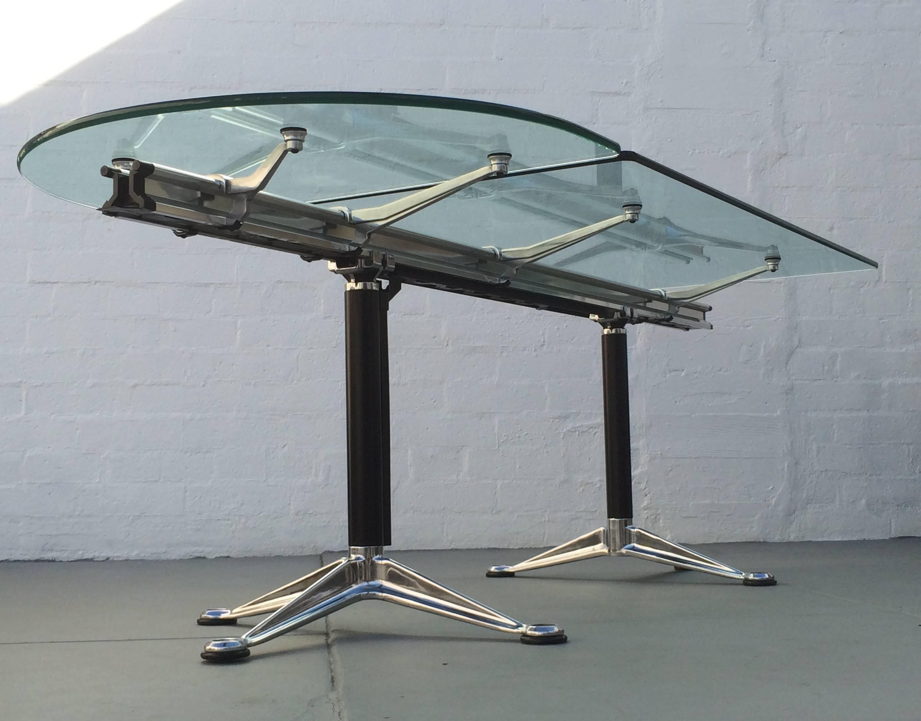 That cool design table can be used in an office setting or works just as well in a home environment as a dining table, or worktable. 
Designed by Bruce Burdick and made by Herman Miller, circa 1980s. 
Consists of the aluminum base and a 5/8 nice