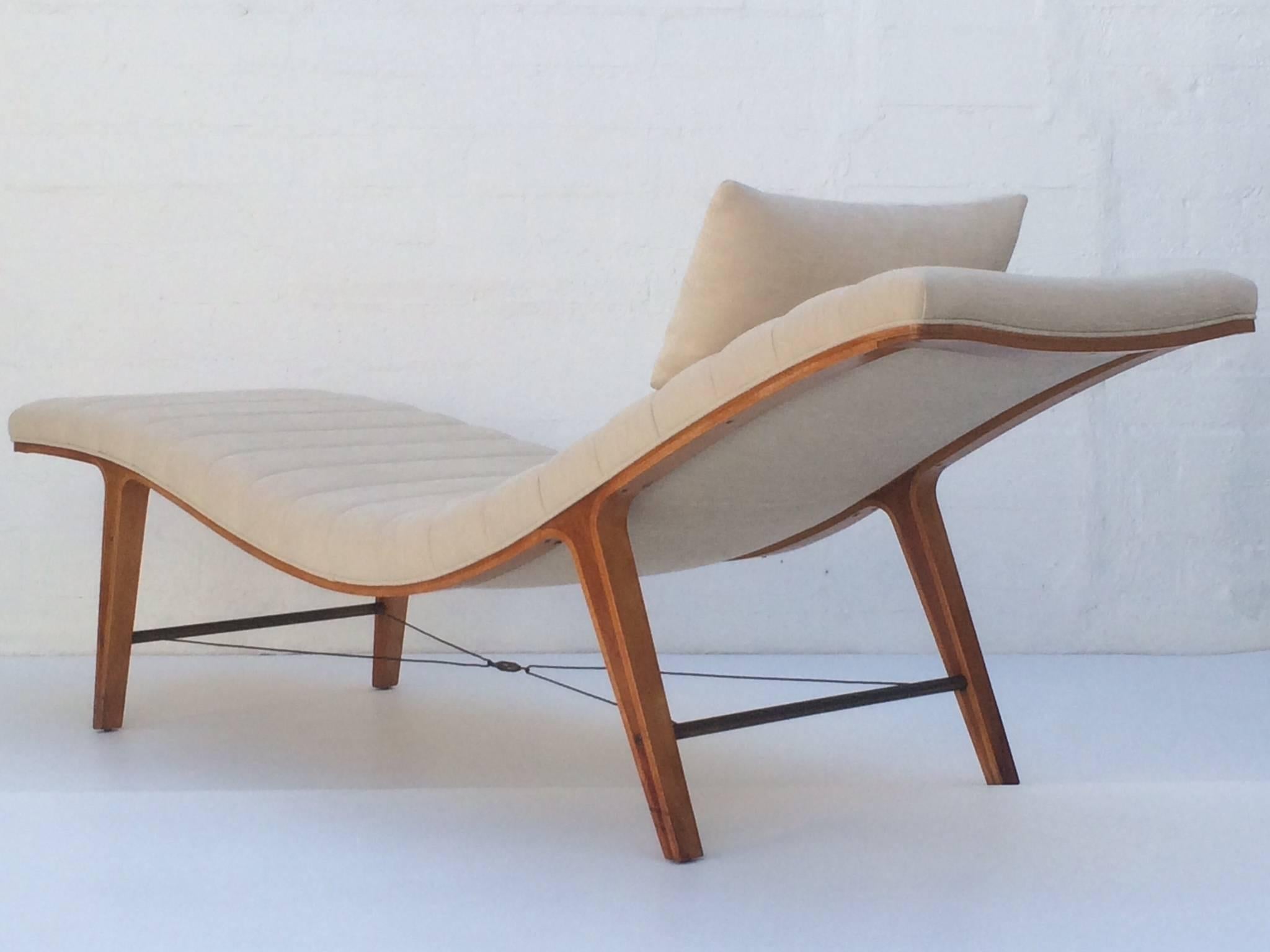 The Listen-to-Me Chasie, circa 1948 is Edward Wormley's most iconic design for Dunbar.
The curvilinear shape and channeled upholstered cushion is supported on a frame of laminated maple and cherry. 
The guide wires add a sculptural flourish.