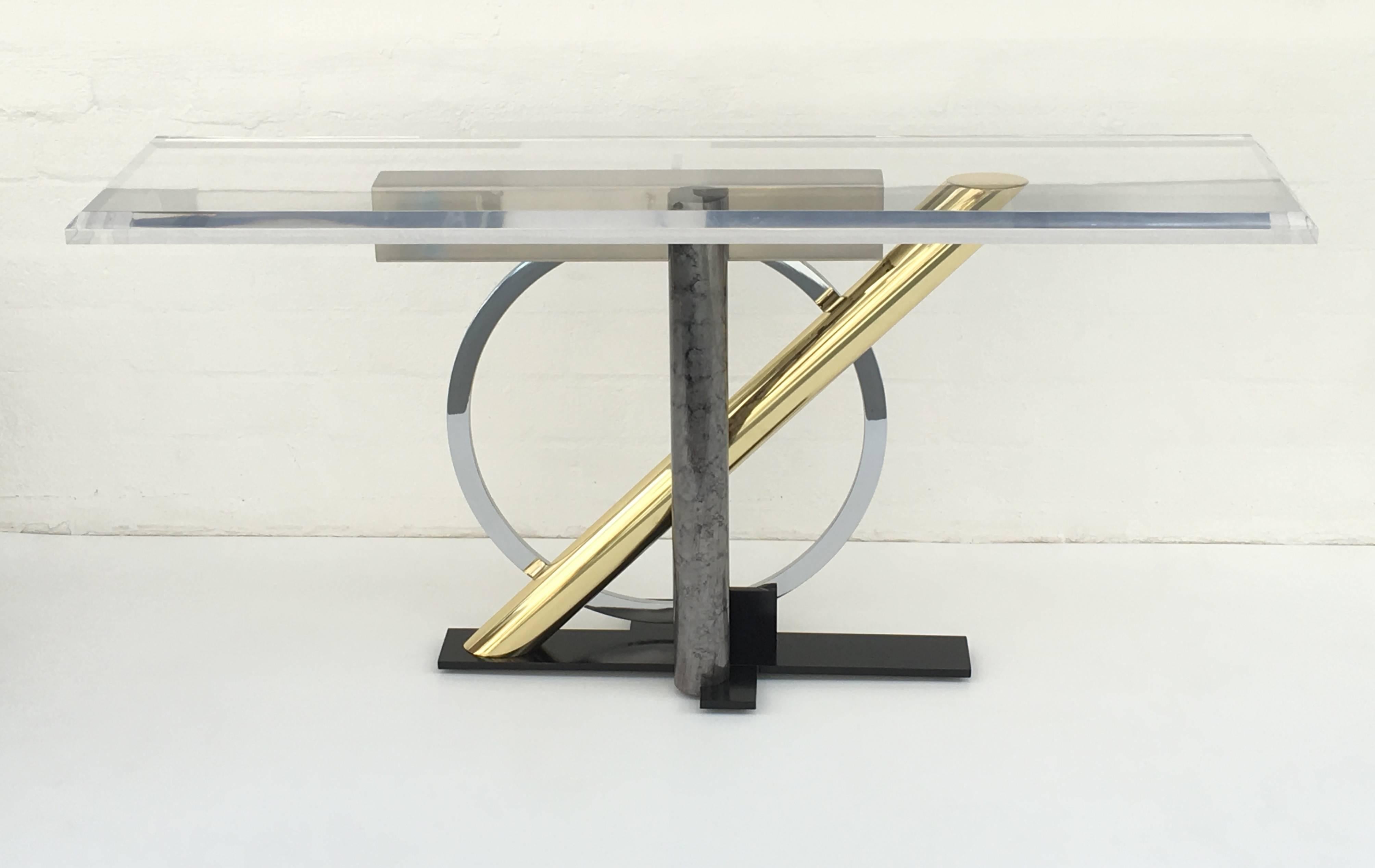 A Postmodern console table made out of mixed metal of brass, chrome, black and white enameled steel. Design by Kaizo Oto for Design Institute of America in the 1980s.

Newly restored and new 1.50