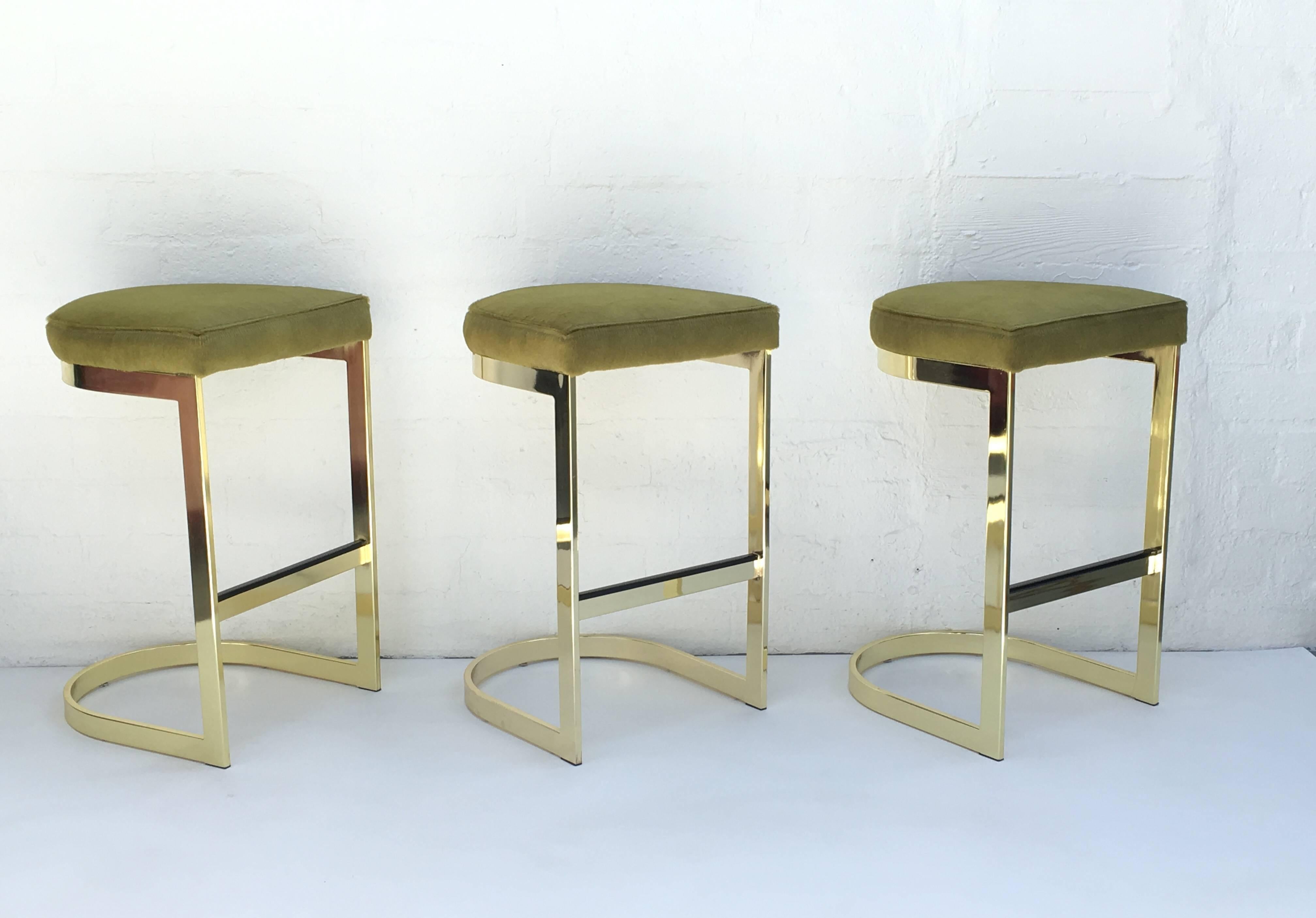Modern Set of Three Polished Brass and Pony Hide Barstools by Milo Baughman 