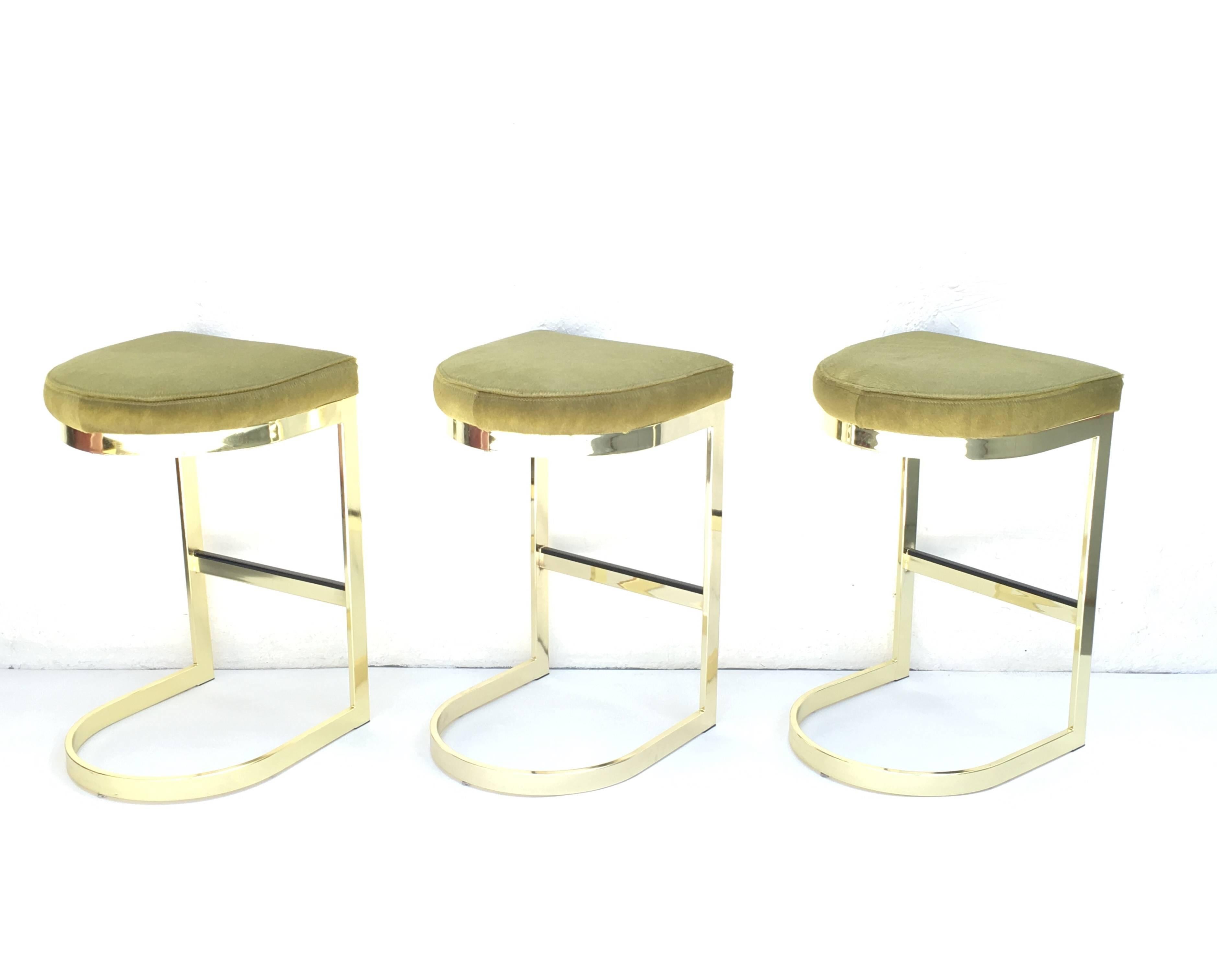 Set of Three Polished Brass and Pony Hide Barstools by Milo Baughman  4