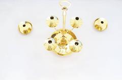 Polished Brass Three-Piece Candelabra Set by Tommi Parzinger