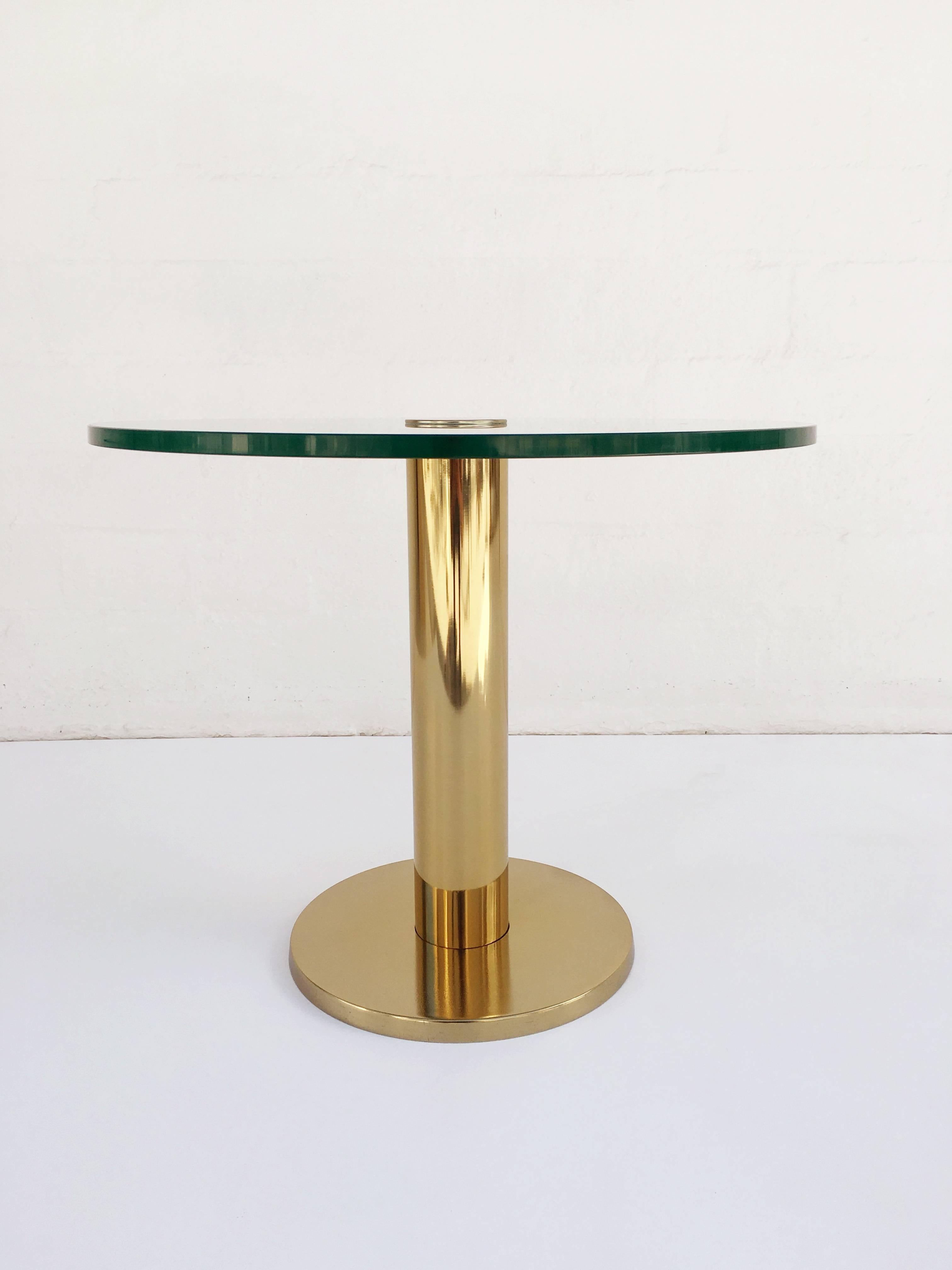 Side table made by Pace Collection, circa 1970s. 
This table consists of polished brass base with a 1/2