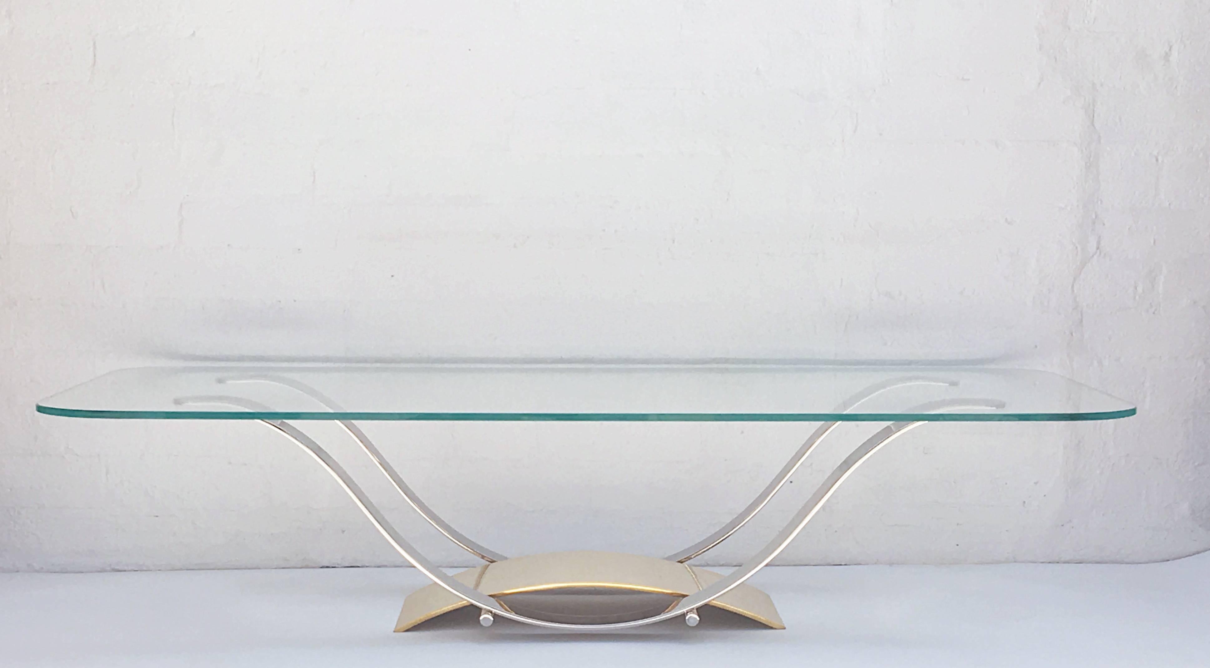 Amazingly designed and well constructed cocktail table.
The table is made out of solid stainless steel and solid brass.
It's designed so you can't see any of the screws that hold the table together.
Newly professionally polished and new 1/2