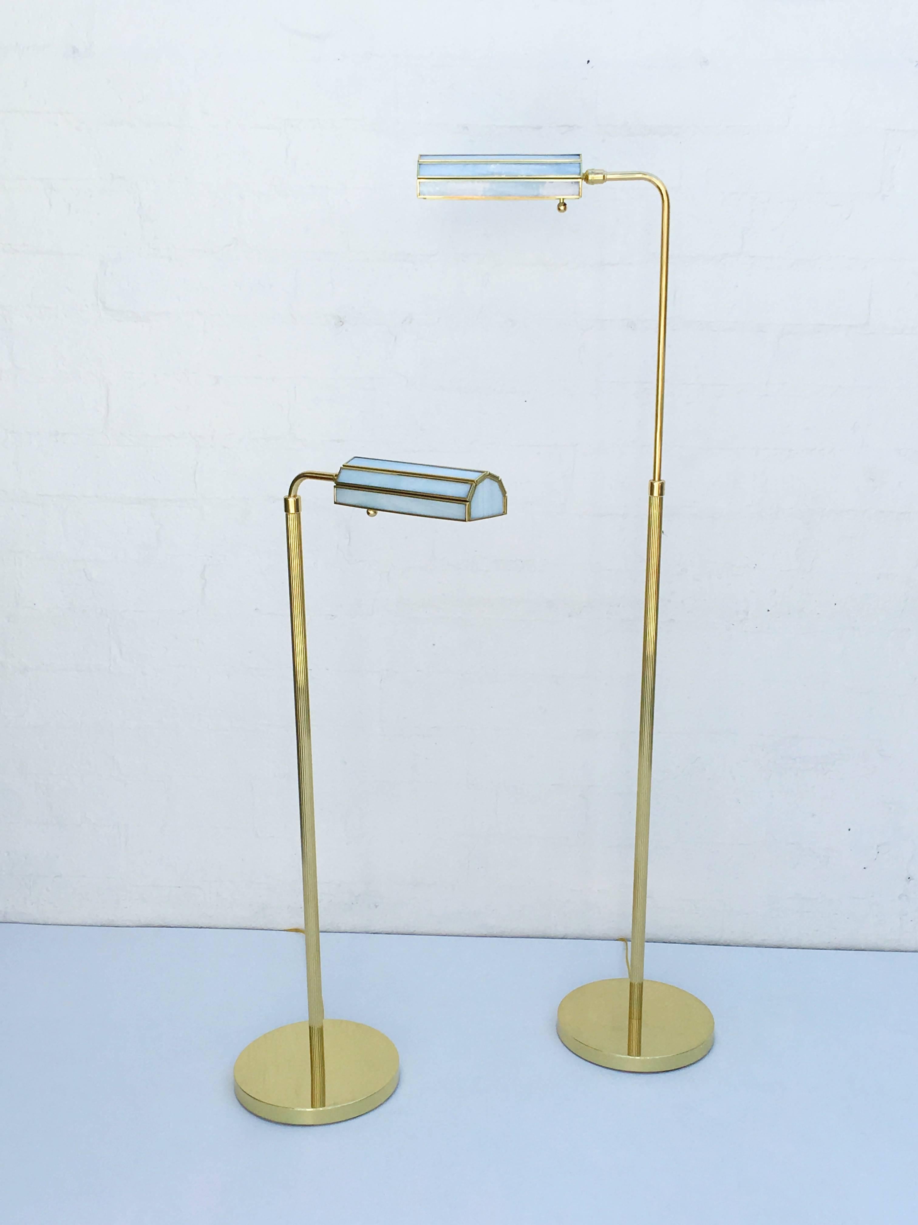 A pair of glamorous 1970s polished brass floor lamps with custom white stained glass shades. Newly professionally polished and rewired.
With full range electronic dimmer.
Dim: 58