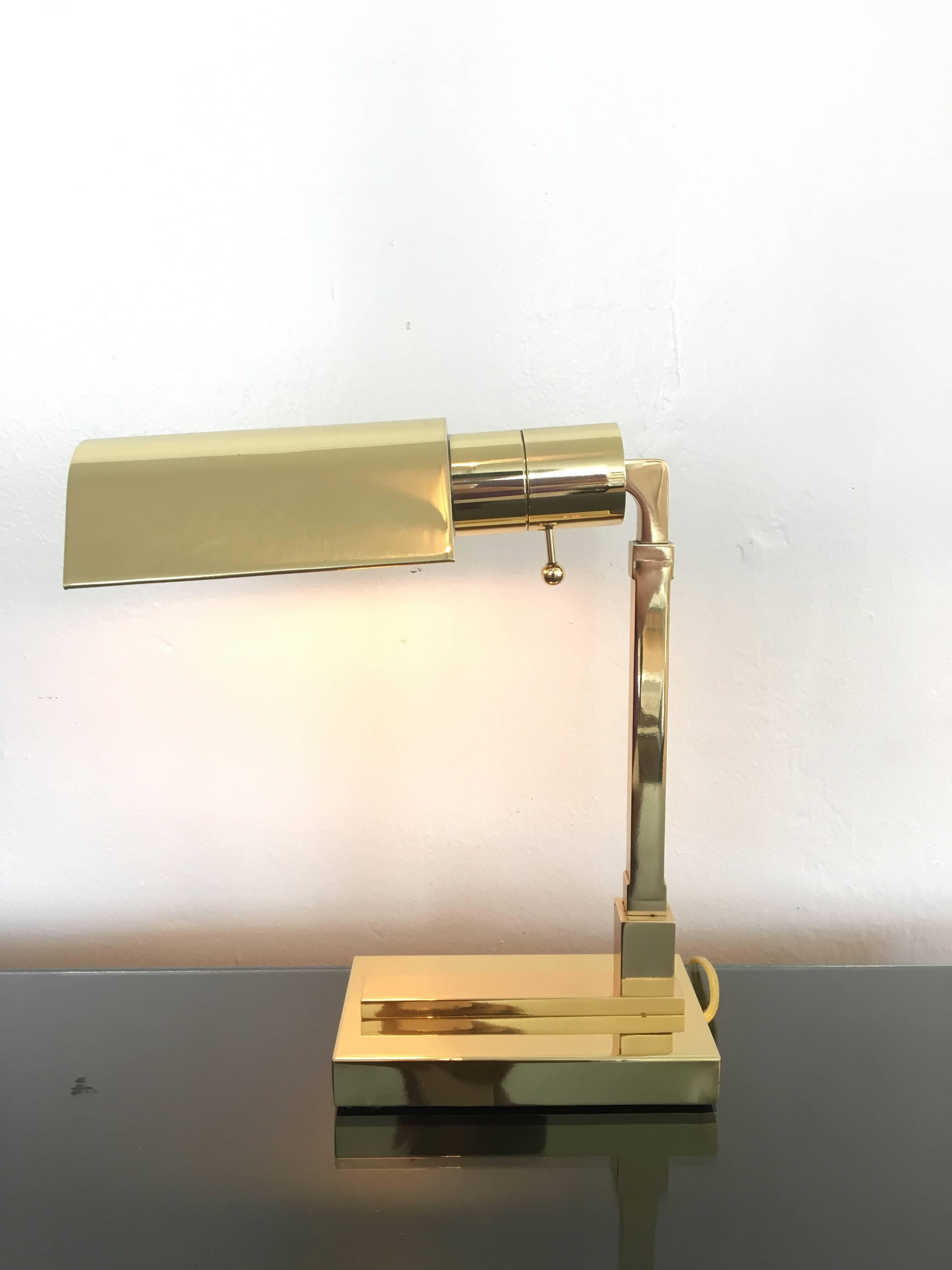 A beautiful small polished brass desk lamp by Casella Lighting.
Professionally polished and rewired with a high/low switch.