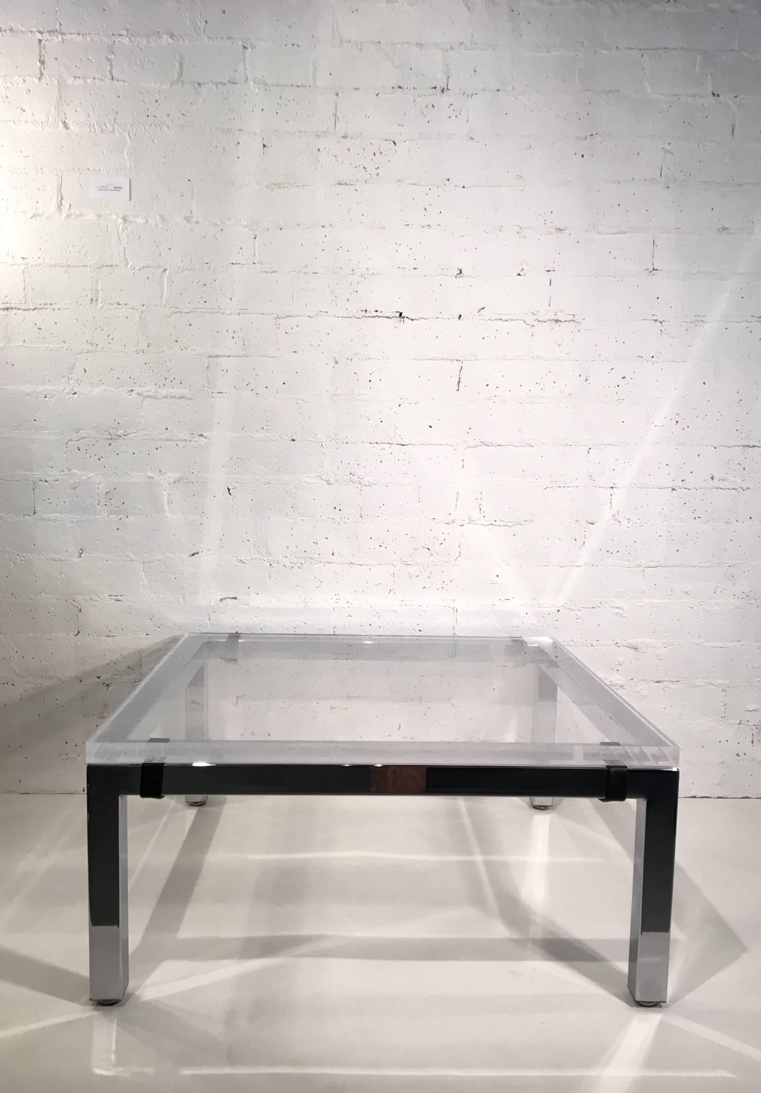 An early 1960s chrome cocktail table designed by Charles Hollis Jones.
The crome is polished chrome with black leather straps that protect the 1.25