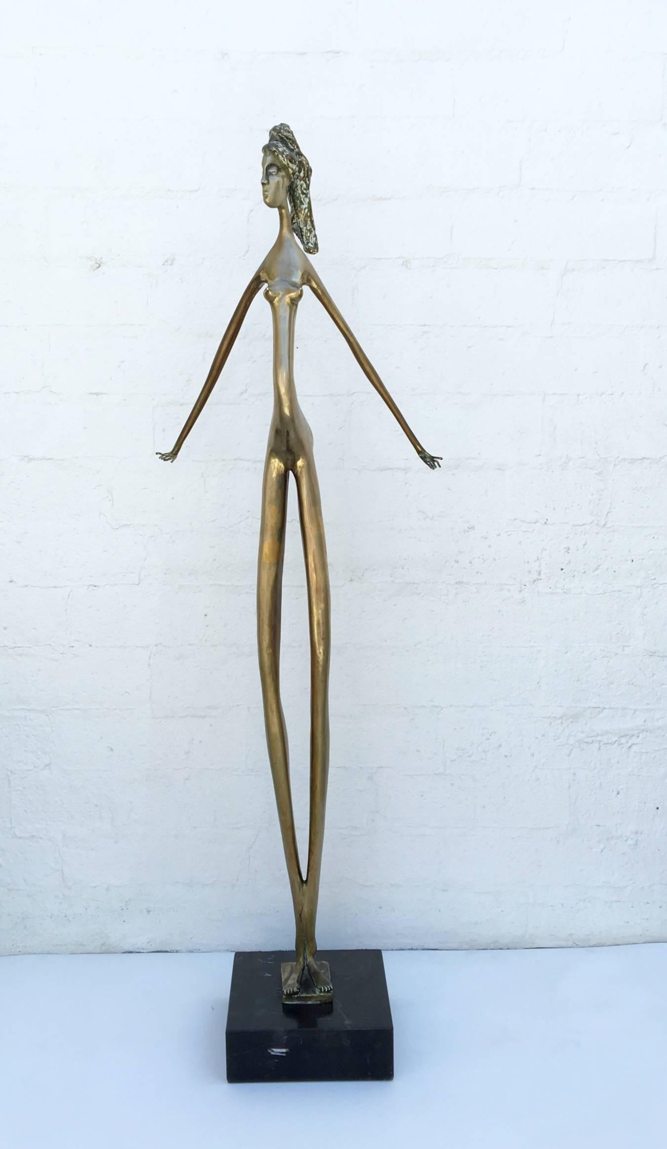 A beautiful well proportion slender women bronze sculpture from the 1970s.
Not signed but on the right leg it has 