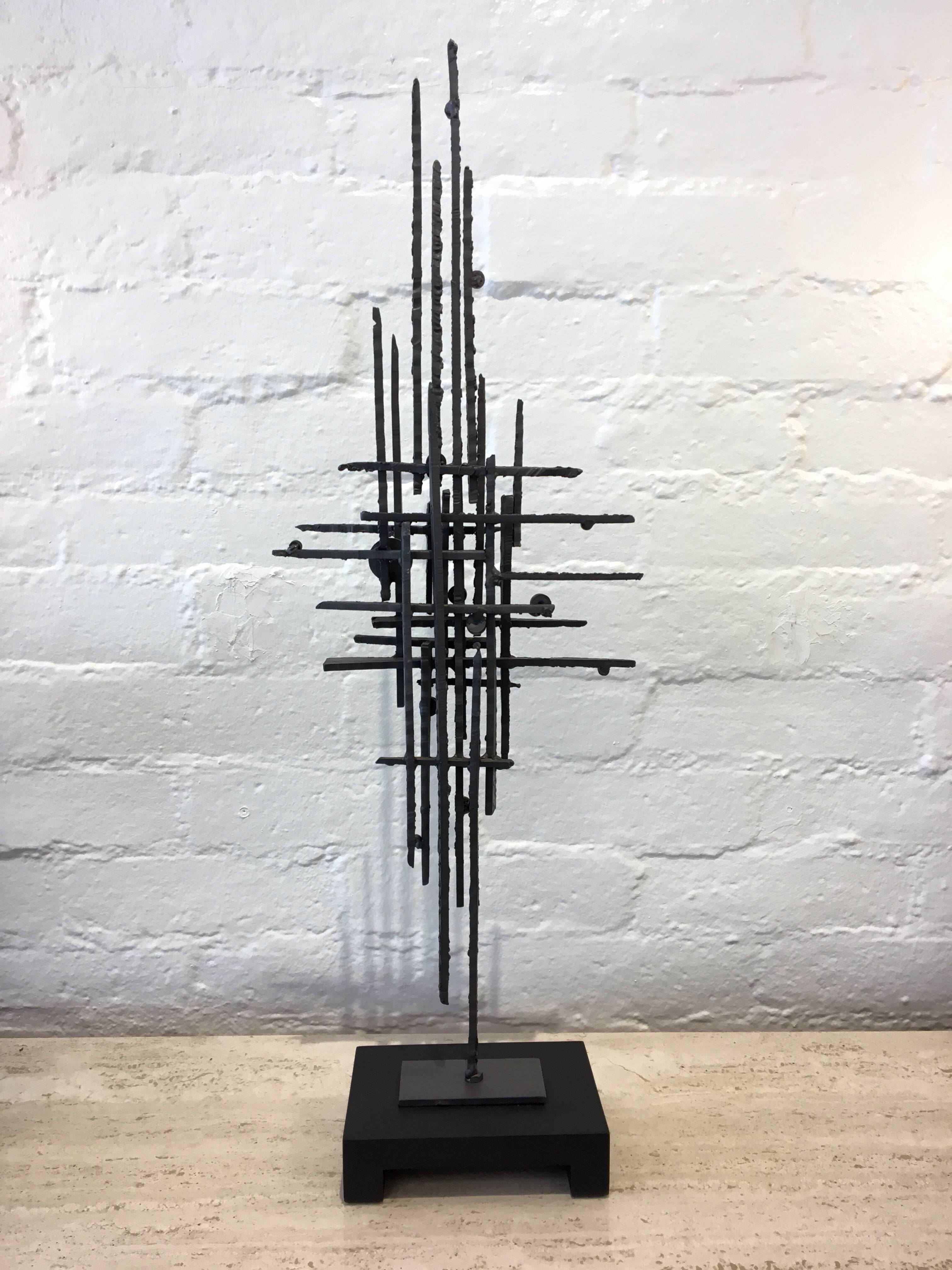 A studio Brutalist steel freestanding sculpture with yellow and orange acrylic circles by American sculptor John De La Rosa.
The base is painted wood. 
Dim: 
Base- 8.25