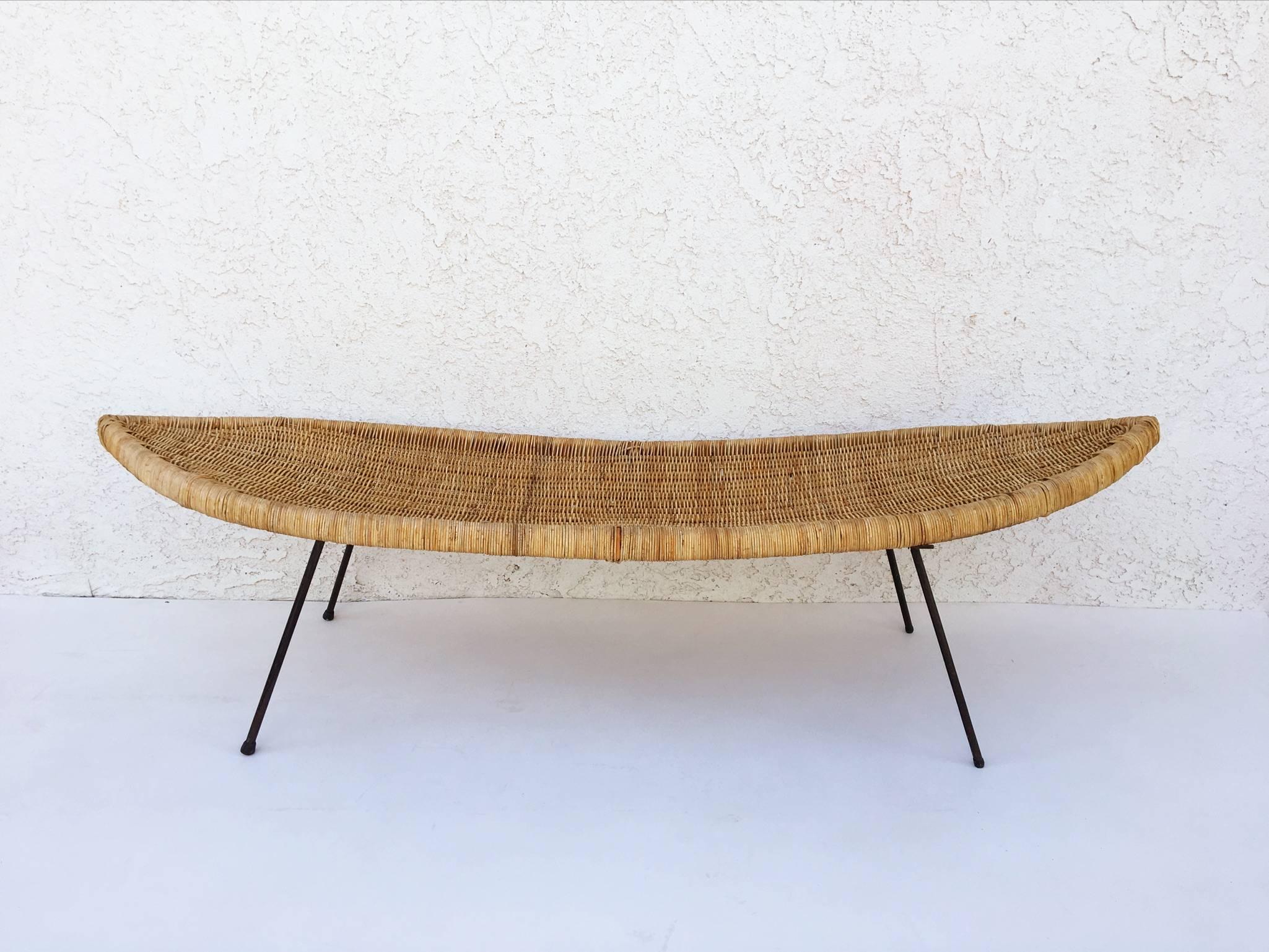 An amazing surfboard shape cocktail table constructed by wicker and steel legs,
circa 1960s. 
This is in original condition. 
Dimensions: 18