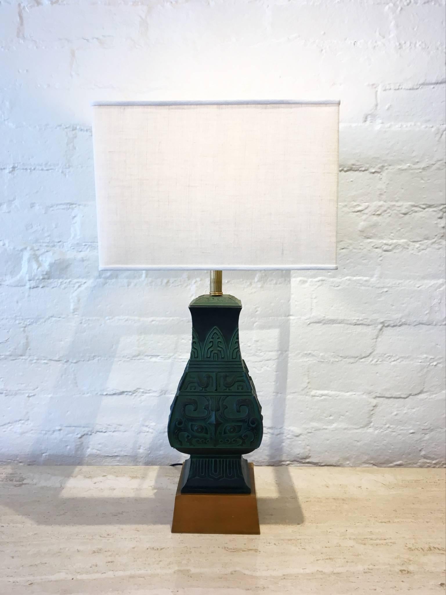 1960s cast bronze with brass hardware on a wood base table lamps in the manner of James Mont. Newly rewired and new vanilla linen shades. Lamps can be purchased without shades. 

Dimensions:31